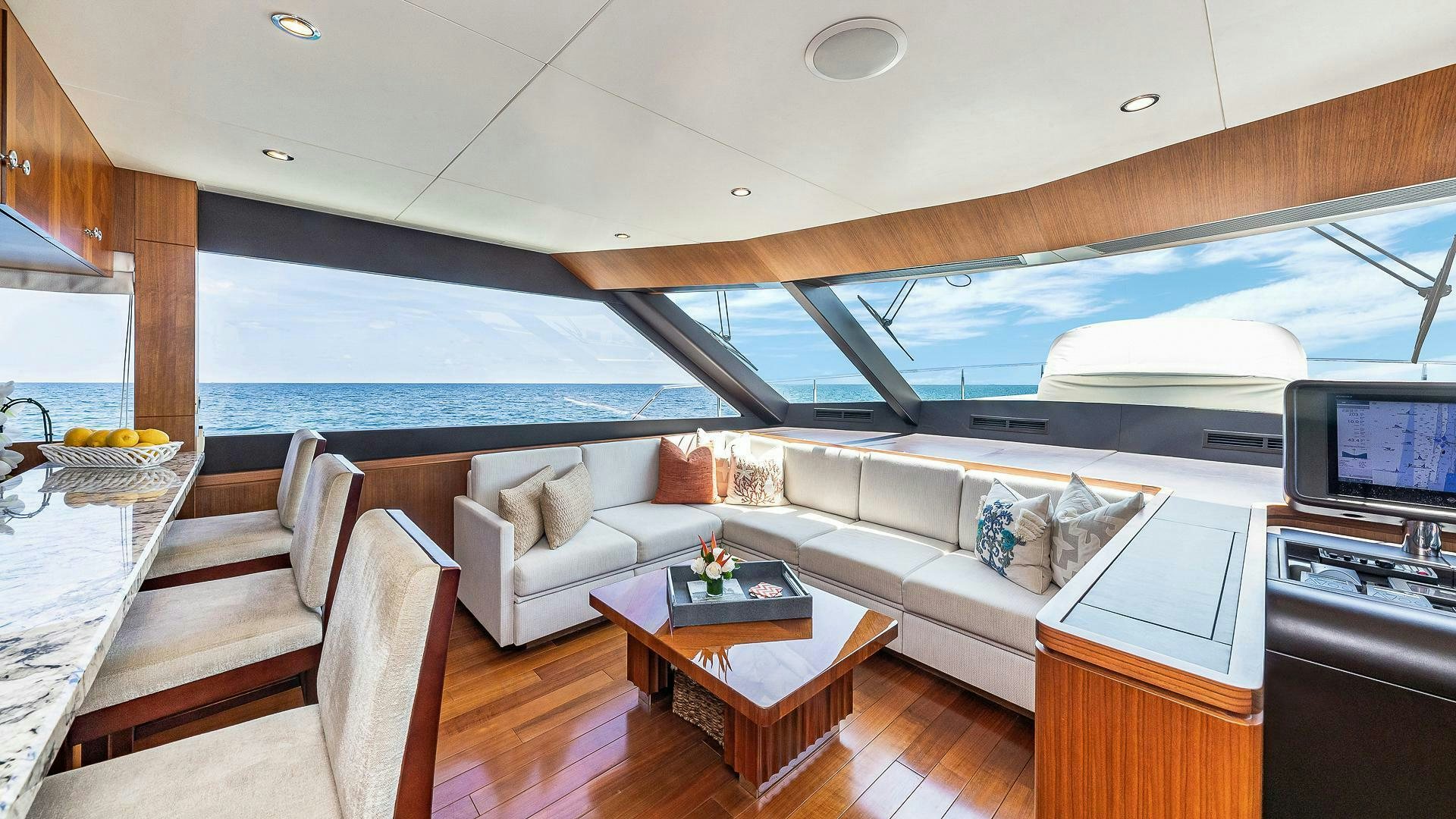a living room with a large window aboard NOW WE KNOW Yacht for Sale
