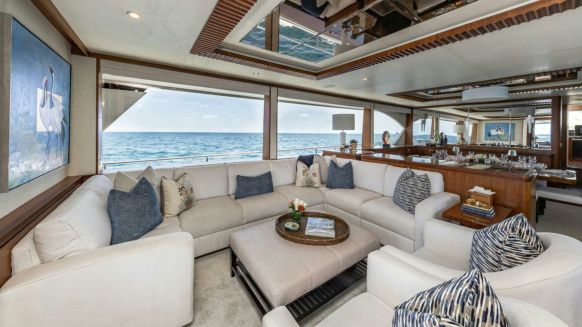 a living room with a large window aboard NOW WE KNOW Yacht for Sale