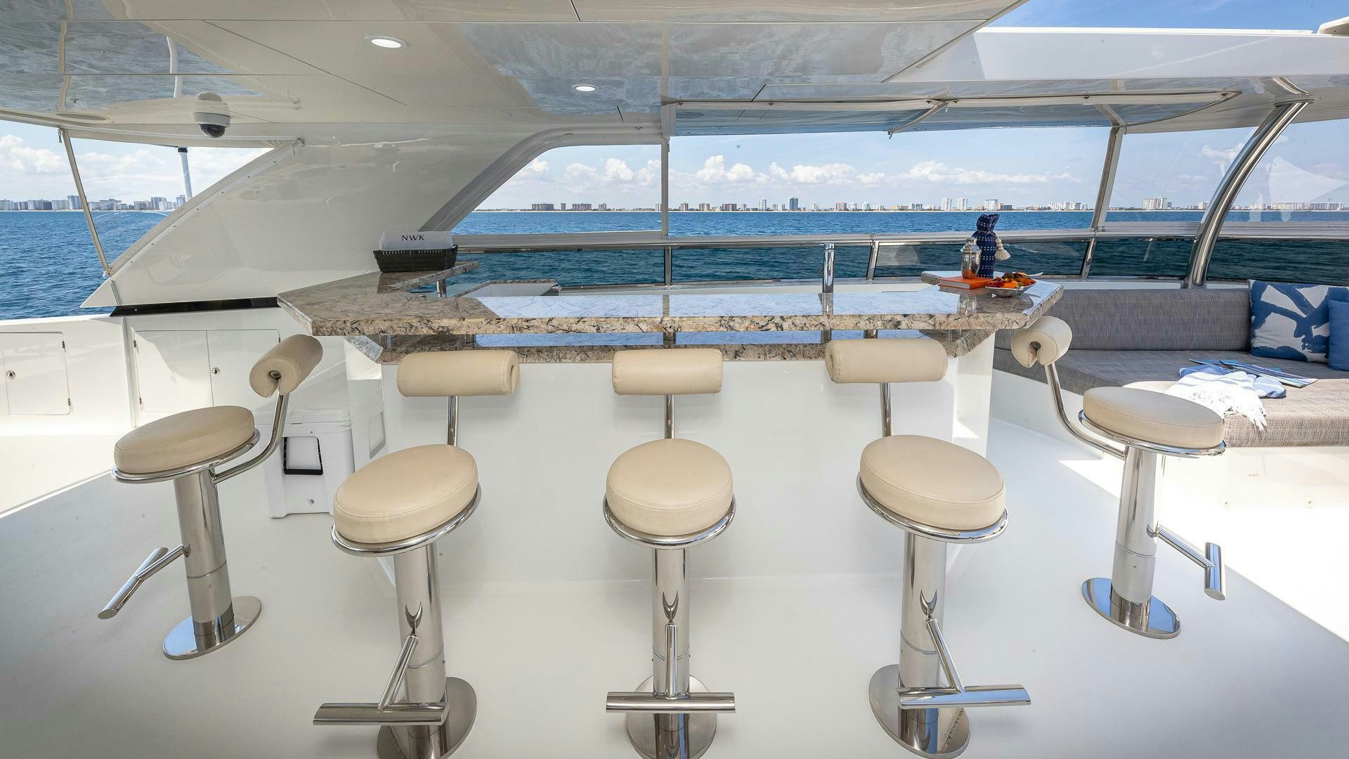 a boat with stools and stools on it aboard NOW WE KNOW Yacht for Sale