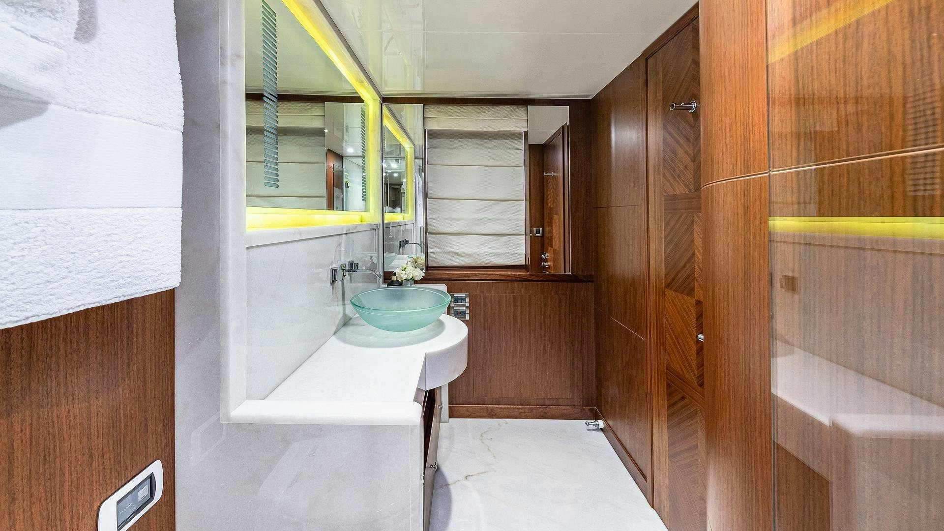 a bathroom with a sink and a mirror aboard NOW WE KNOW Yacht for Sale