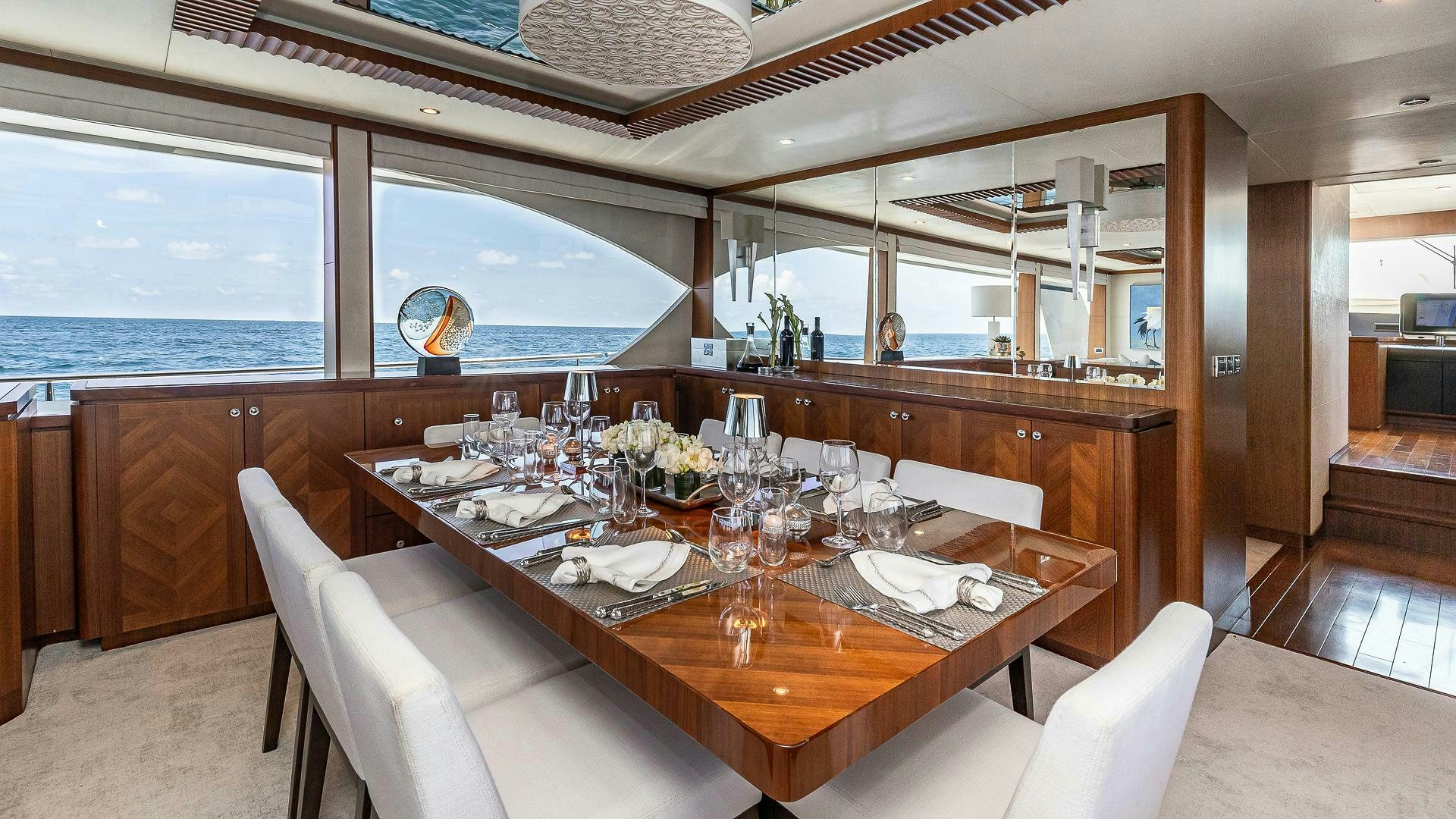 a dining table in a room aboard NOW WE KNOW Yacht for Sale