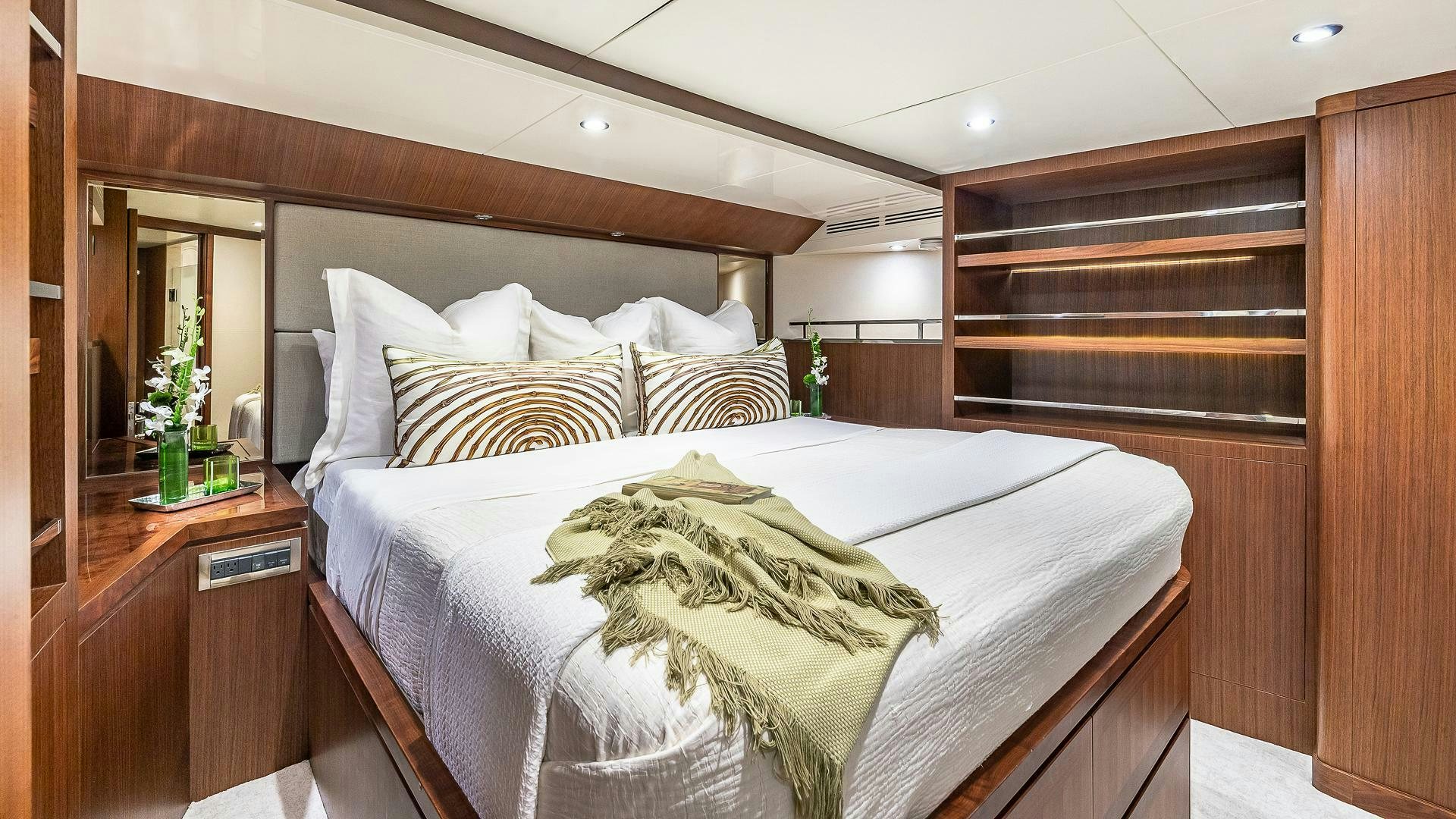 a bed with a white comforter aboard NOW WE KNOW Yacht for Sale
