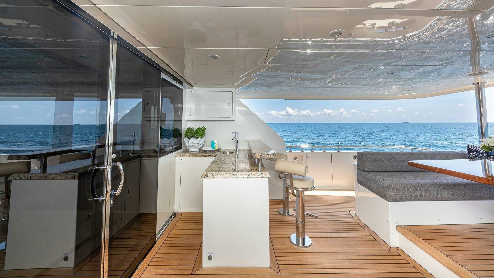 a modern looking room with a large glass window aboard NOW WE KNOW Yacht for Sale