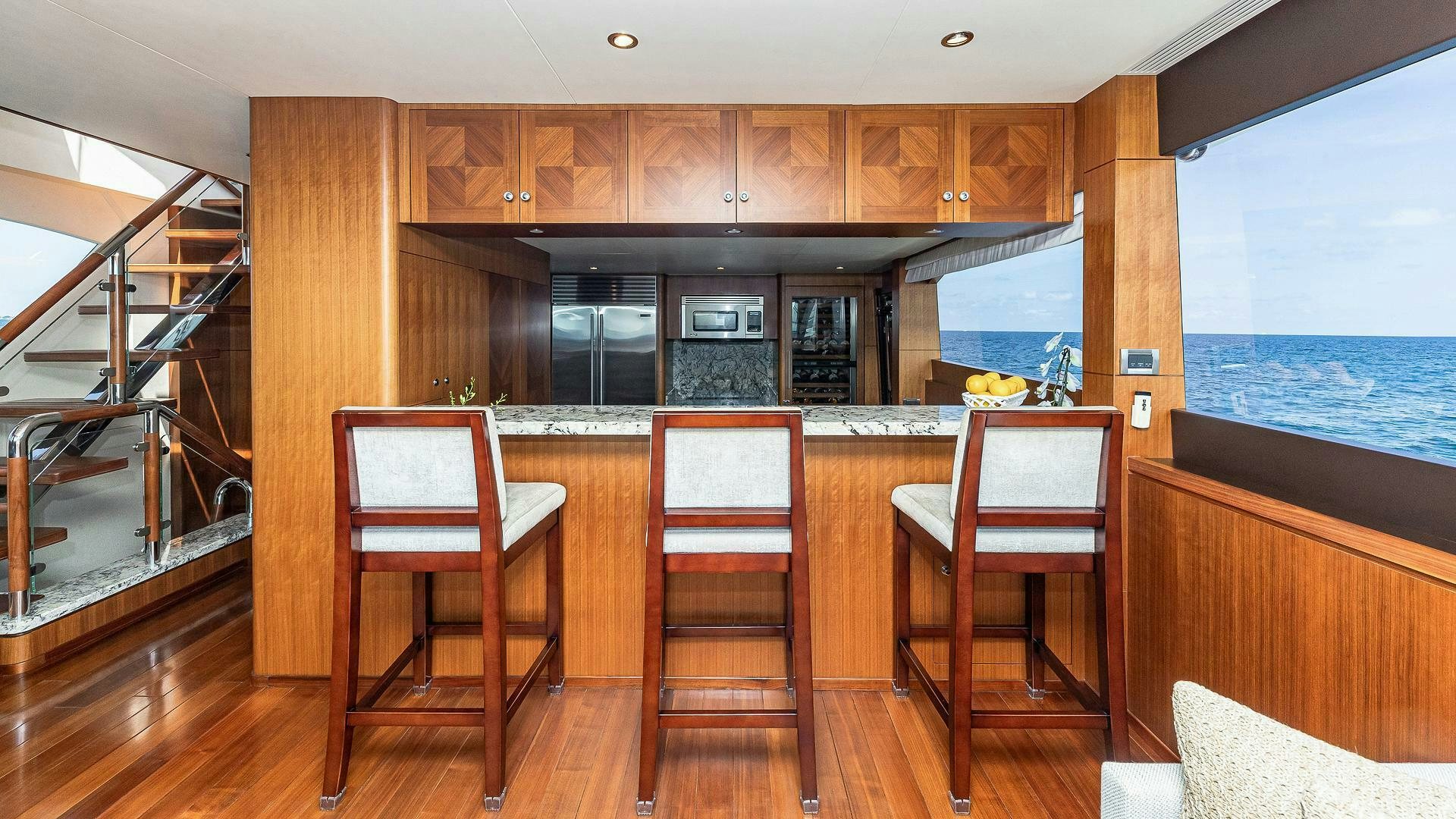 a kitchen with wooden cabinets aboard NOW WE KNOW Yacht for Sale