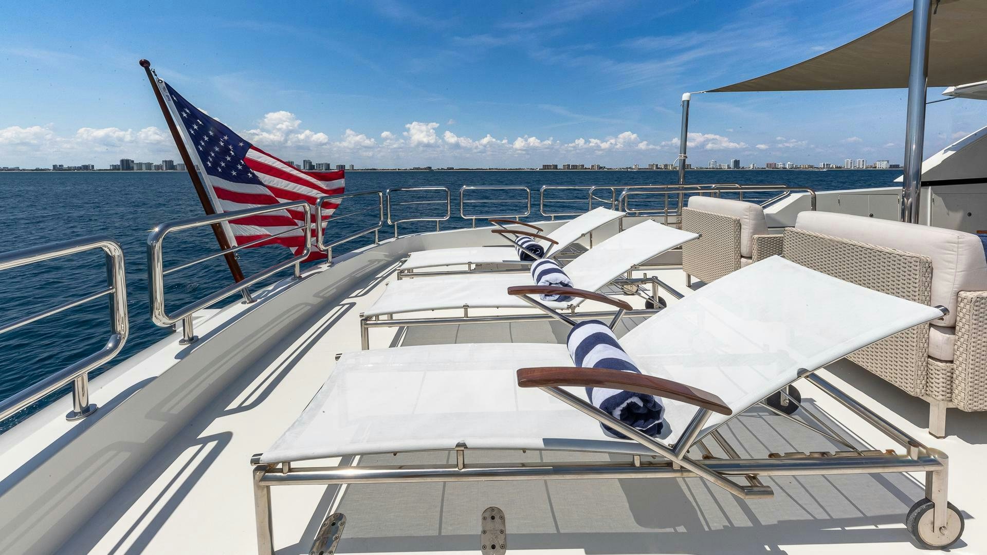 a group of white boats with flags on them aboard NOW WE KNOW Yacht for Sale