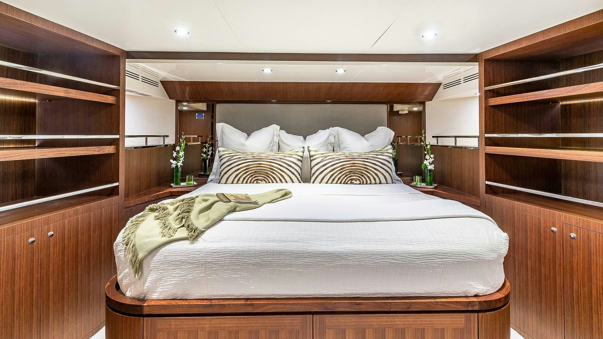 a bed with white sheets aboard NOW WE KNOW Yacht for Sale