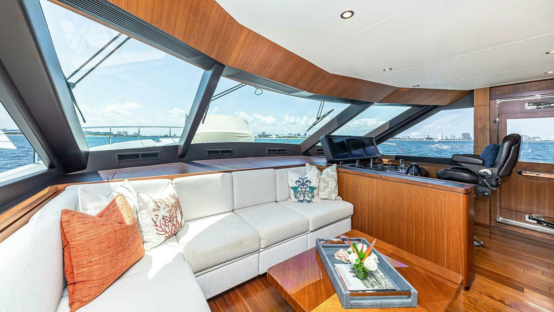 a living room with a couch and a table aboard NOW WE KNOW Yacht for Sale