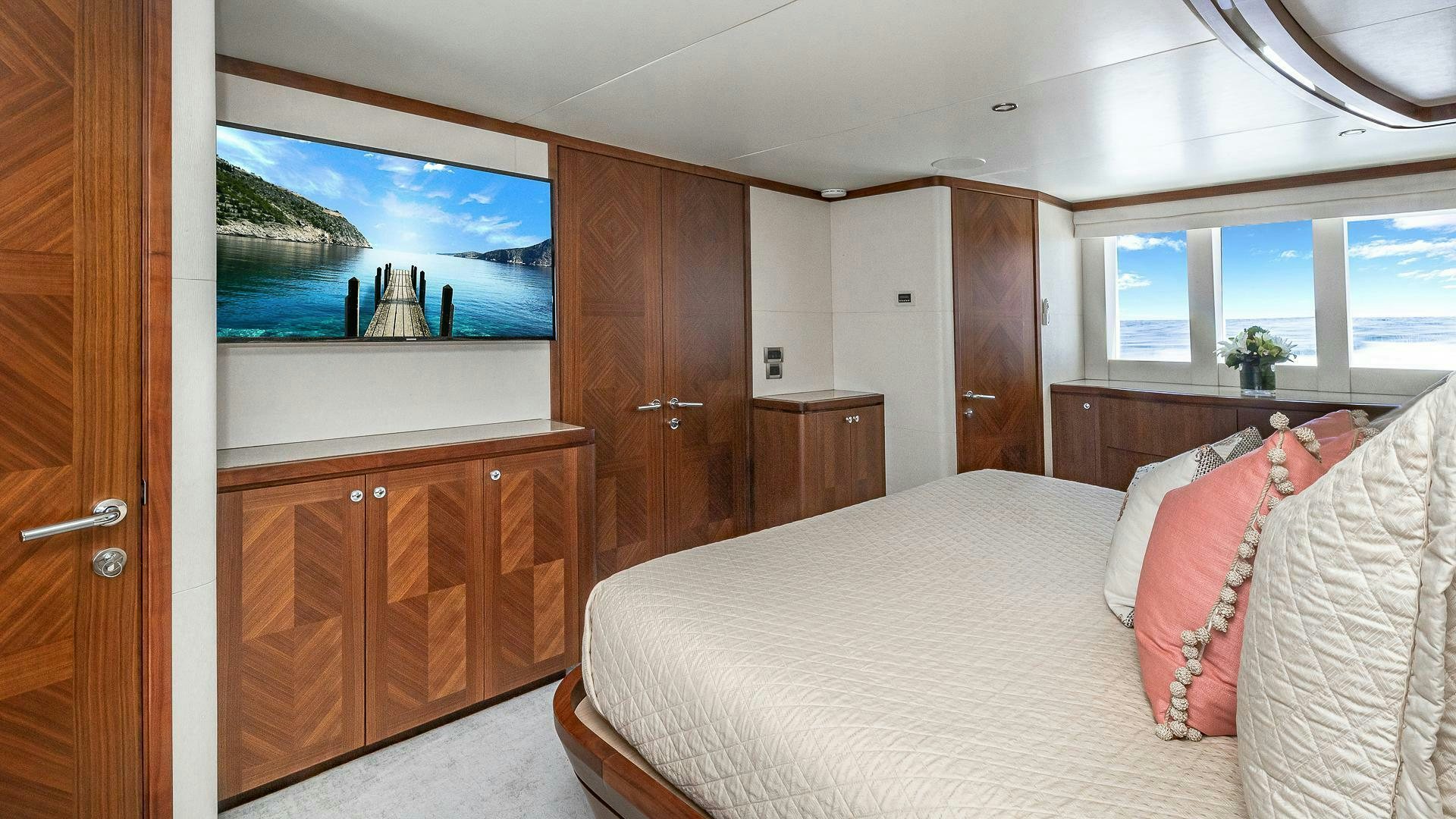 a bedroom with a bed and a television aboard NOW WE KNOW Yacht for Sale