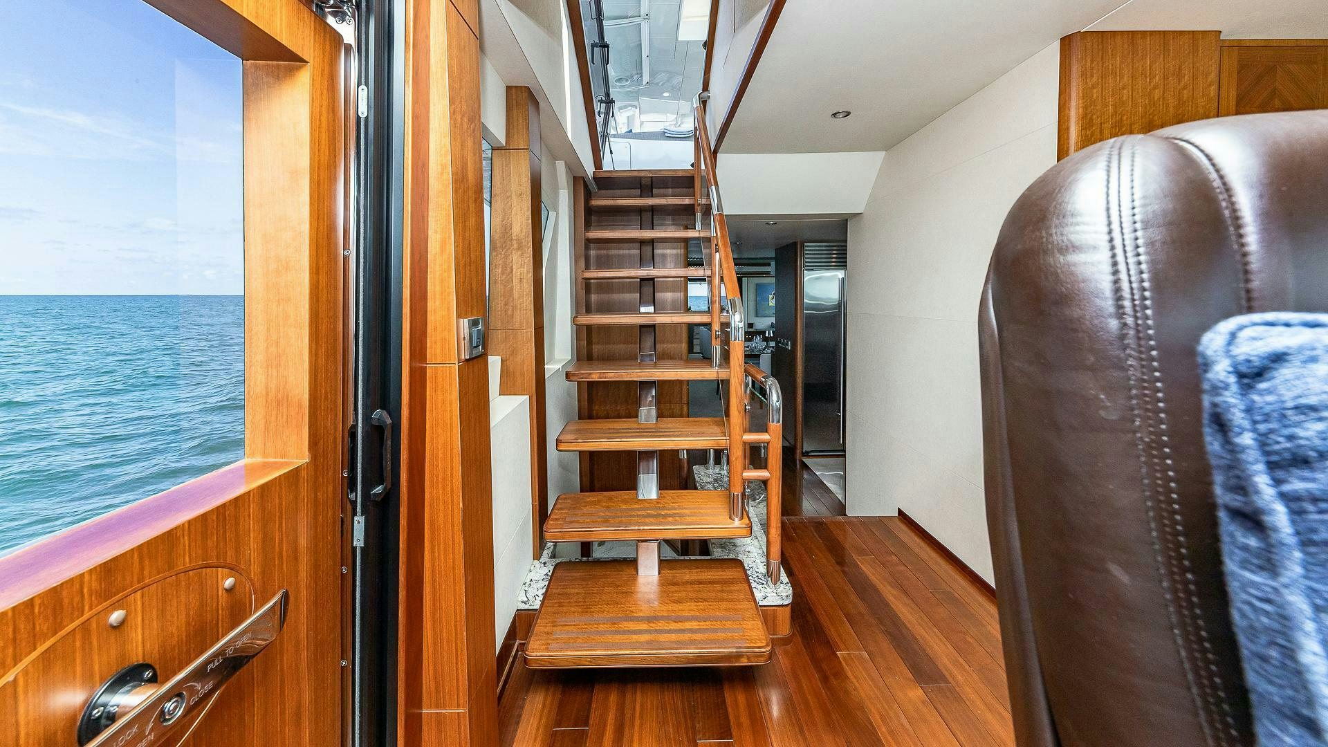 a wooden staircase in a room aboard NOW WE KNOW Yacht for Sale