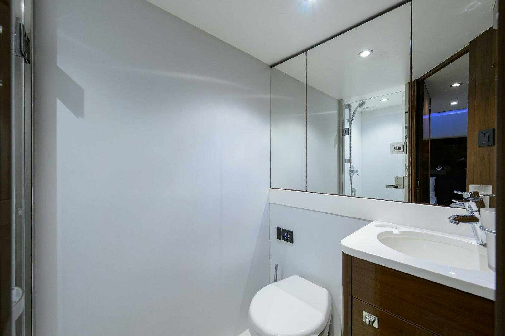a bathroom with a mirror aboard TWIST OF FAITH Yacht for Sale