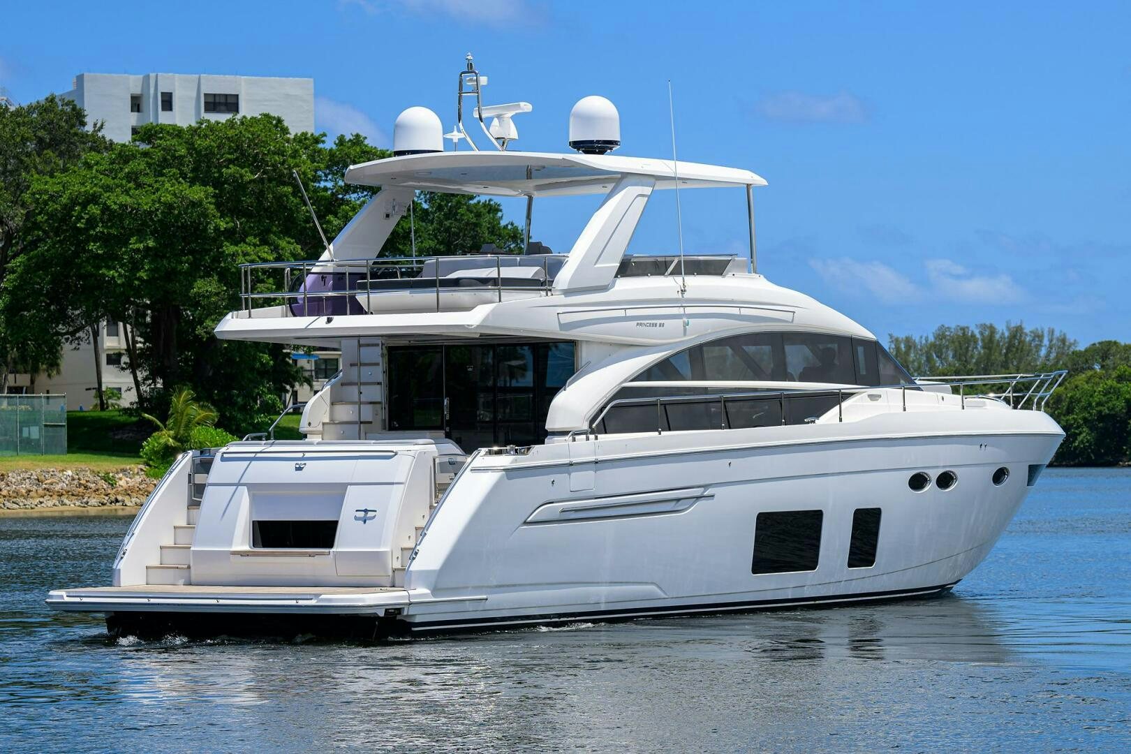 a white yacht on the water aboard TWIST OF FAITH Yacht for Sale