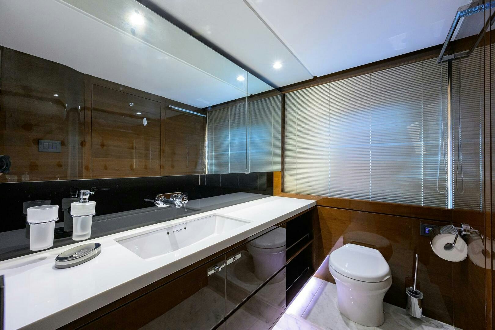 a bathroom with a large mirror aboard TWIST OF FAITH Yacht for Sale