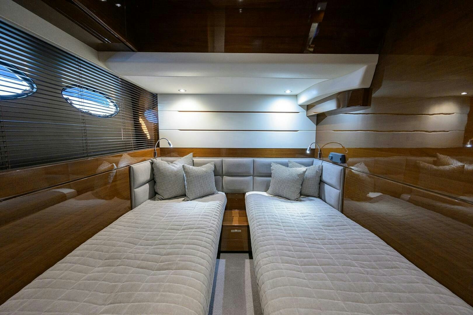 a room with beds and a window aboard TWIST OF FAITH Yacht for Sale