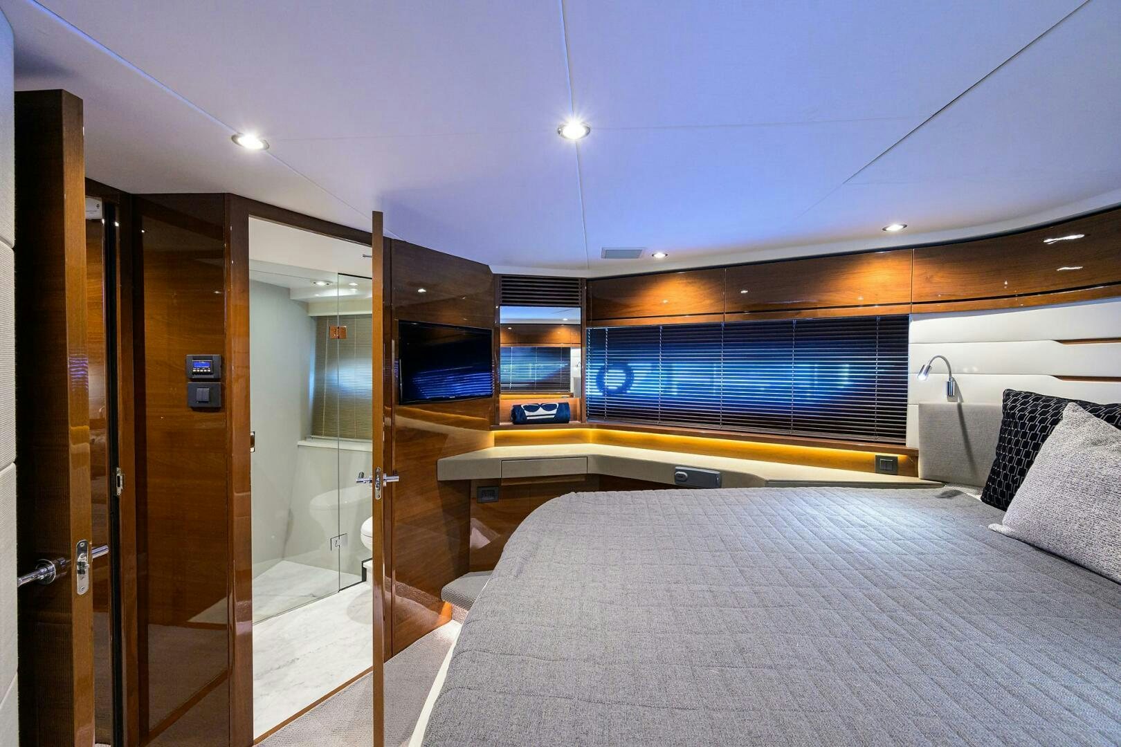 a room with a bed and a door aboard TWIST OF FAITH Yacht for Sale