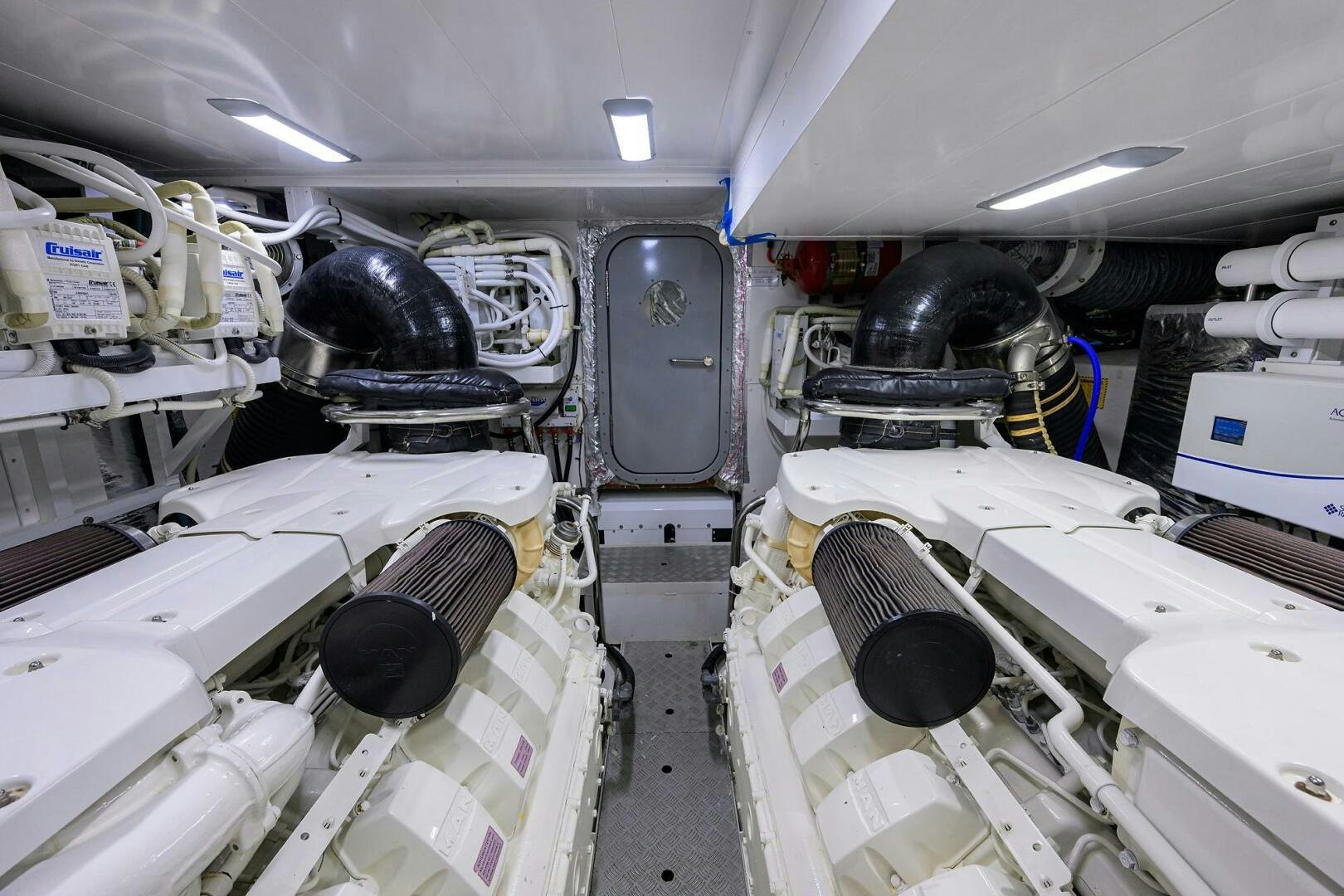 a car with a large engine aboard TWIST OF FAITH Yacht for Sale