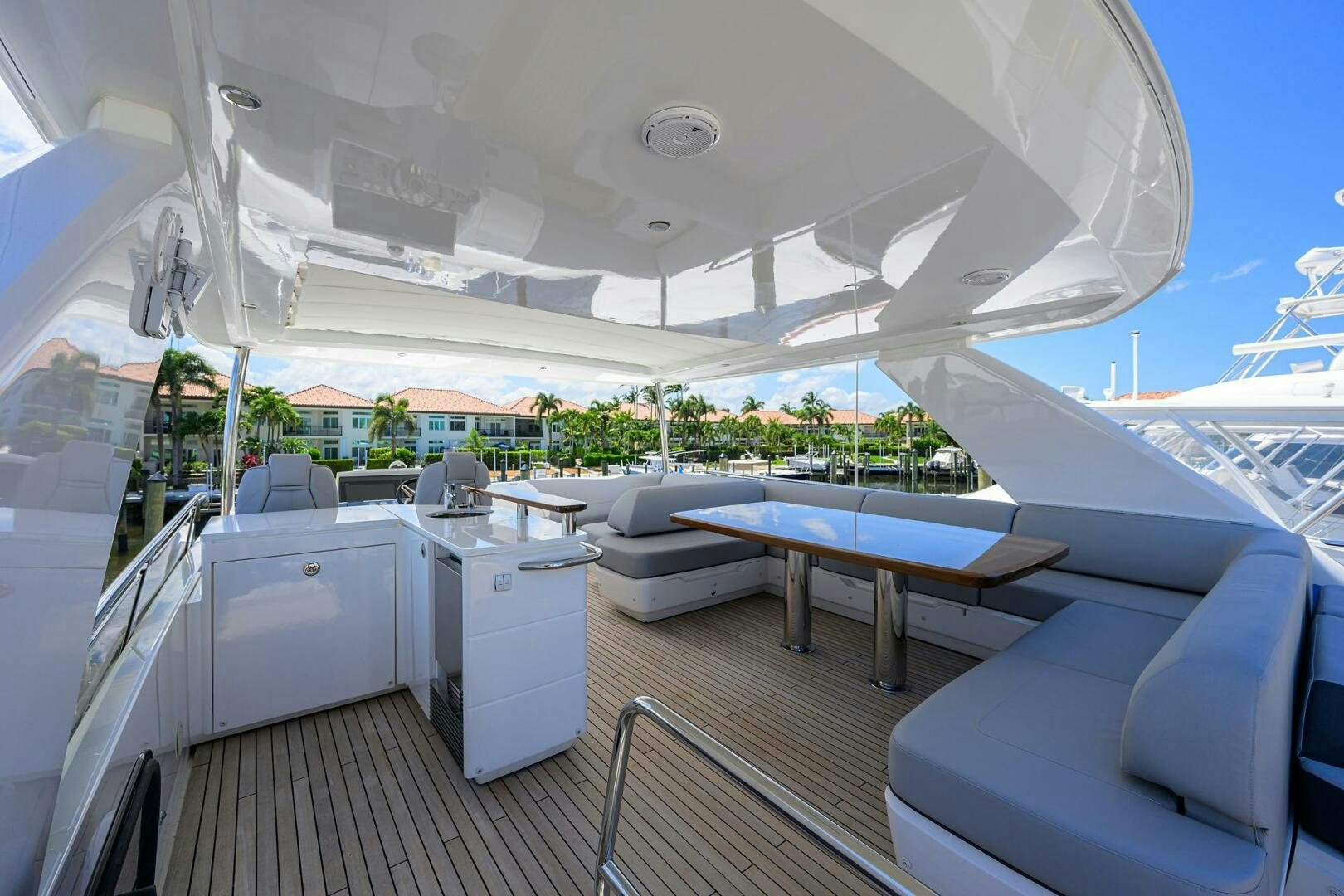 a boat deck with a pool and lounge chairs aboard TWIST OF FAITH Yacht for Sale