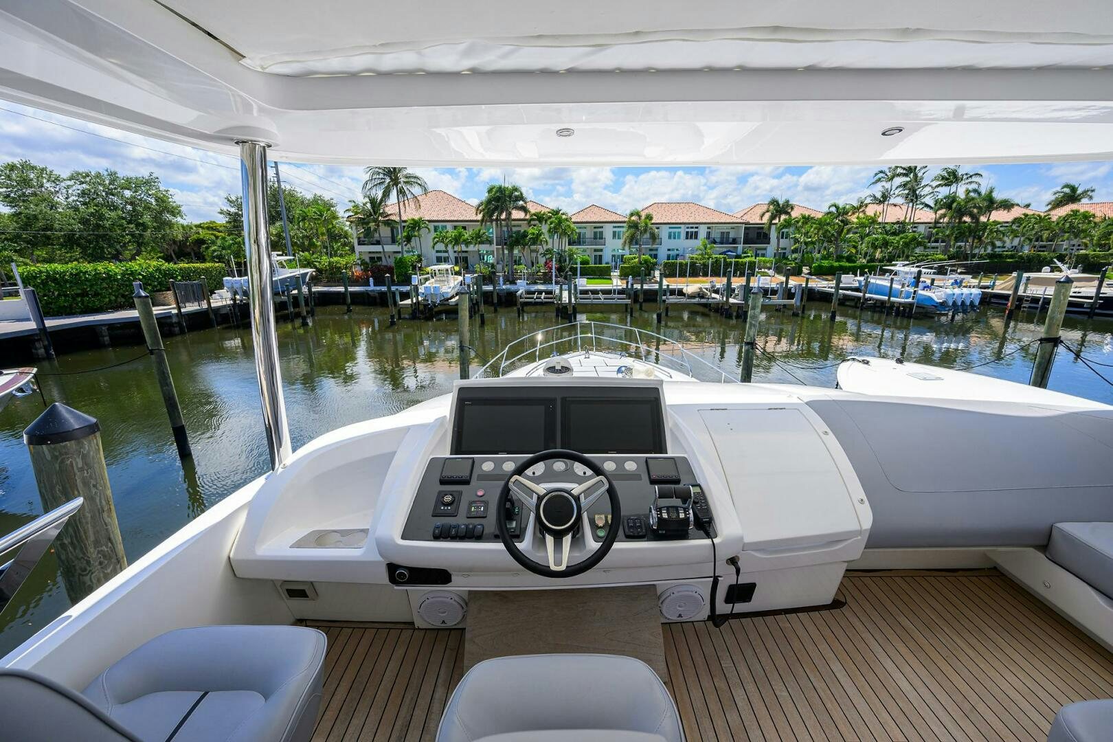 a boat with a steering wheel aboard TWIST OF FAITH Yacht for Sale