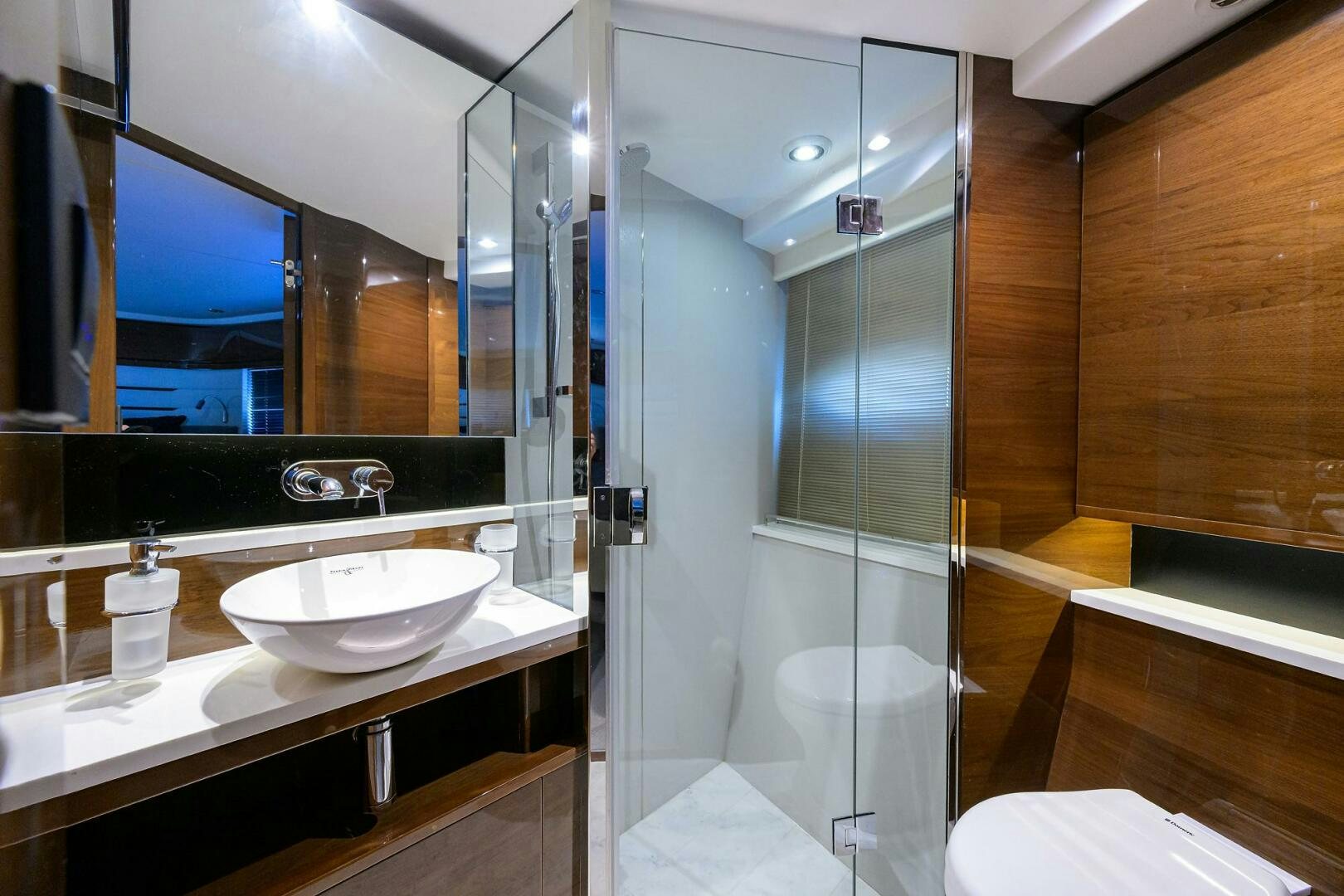 a bathroom with a glass shower aboard TWIST OF FAITH Yacht for Sale