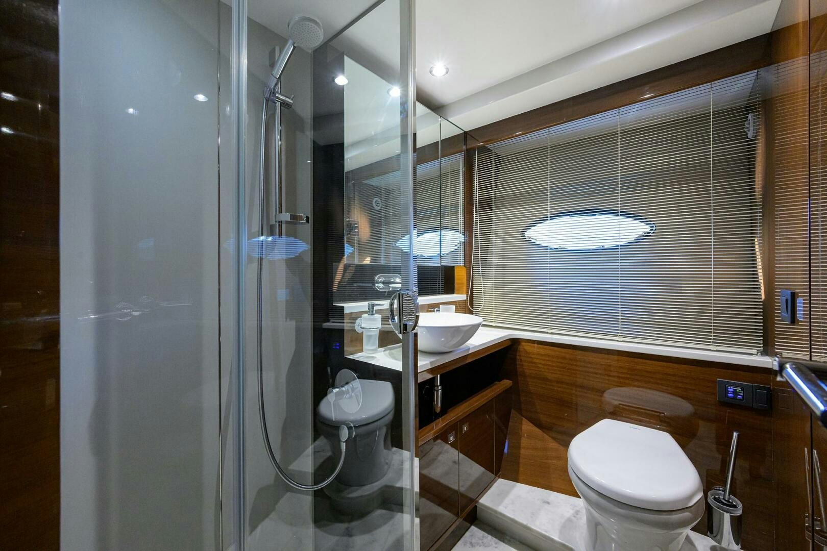 a bathroom with a glass shower aboard TWIST OF FAITH Yacht for Sale