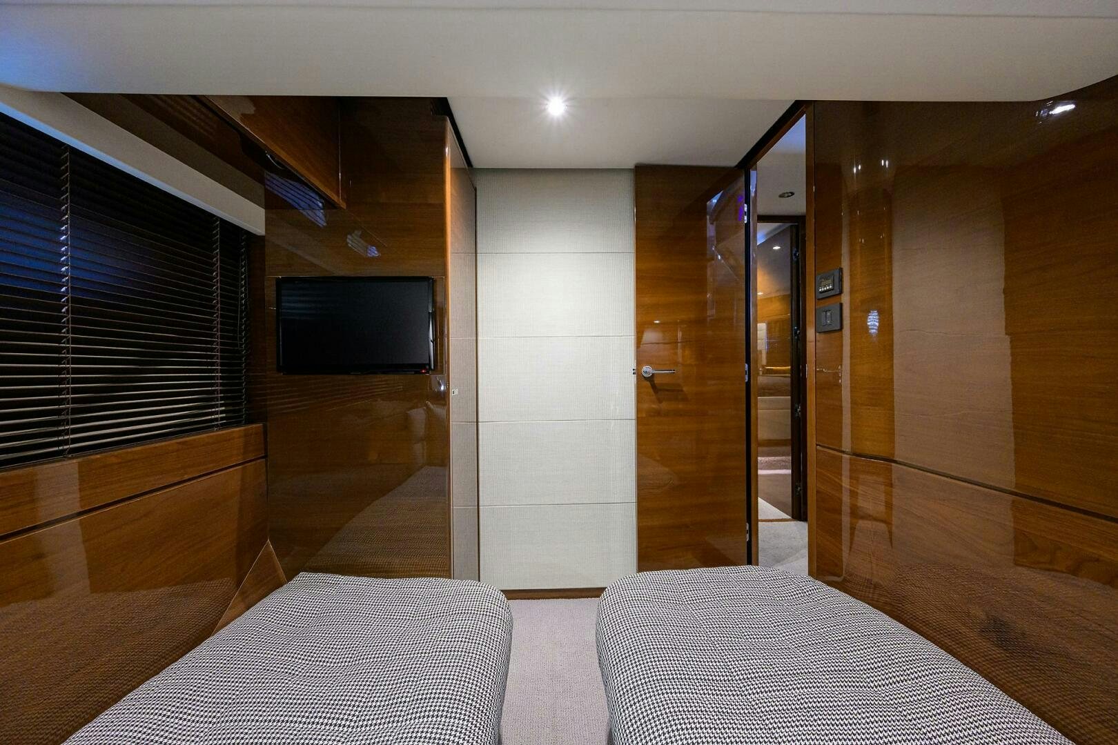 a room with a bed and a tv aboard TWIST OF FAITH Yacht for Sale