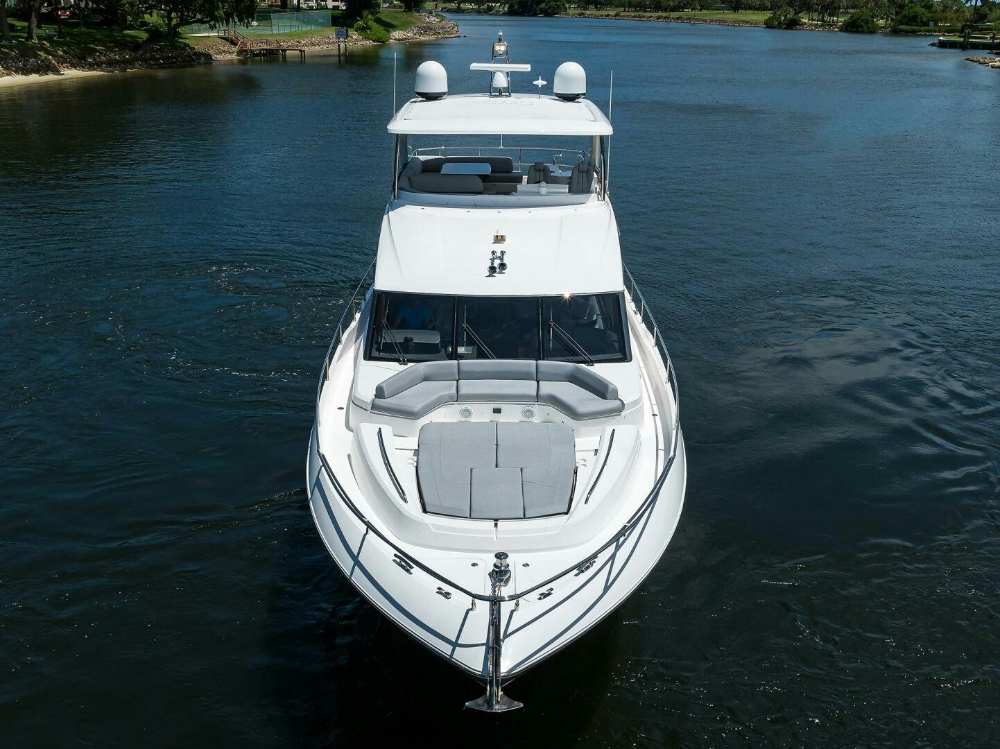 a white boat on the water aboard TWIST OF FAITH Yacht for Sale