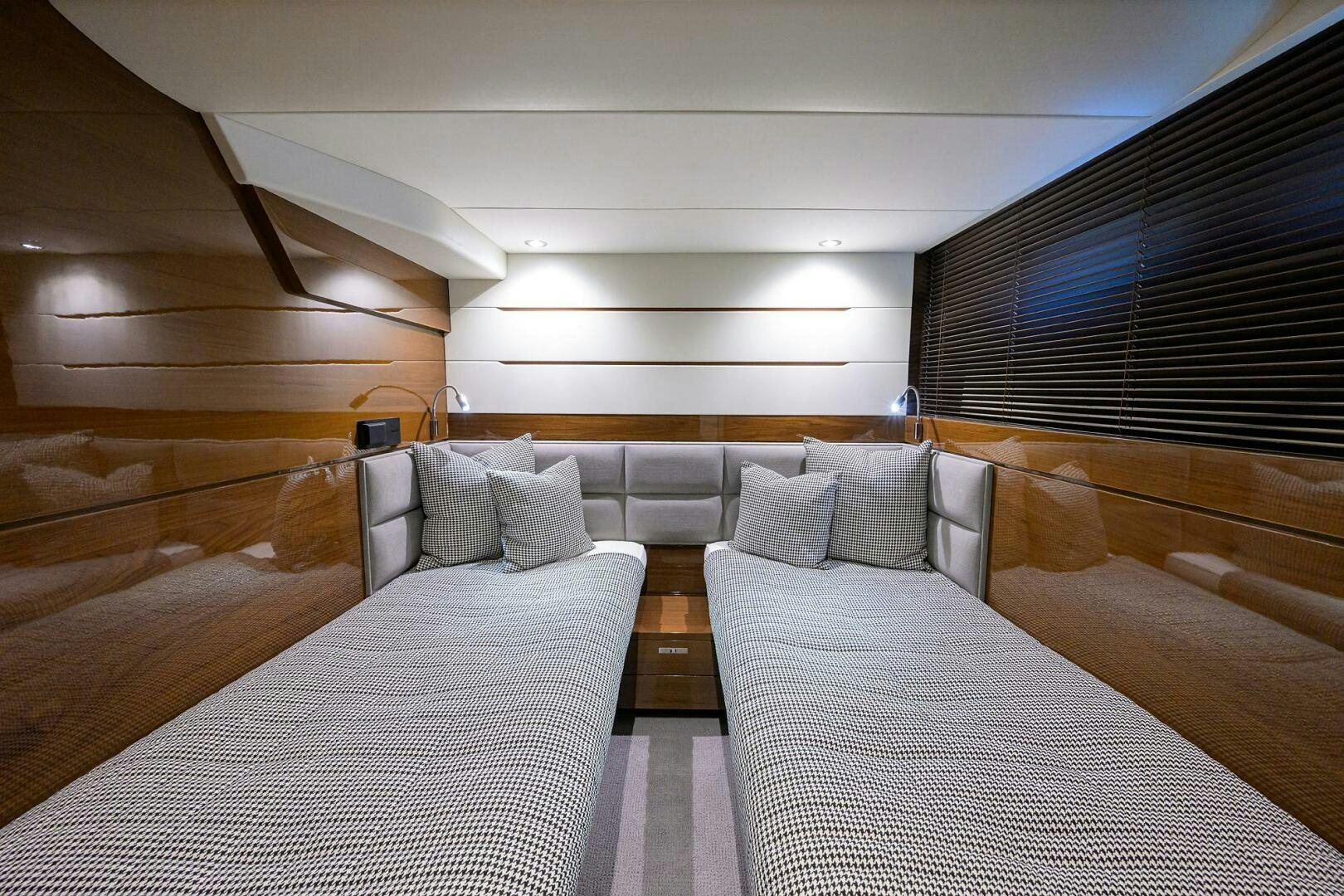 a room with a bed and a large window aboard TWIST OF FAITH Yacht for Sale