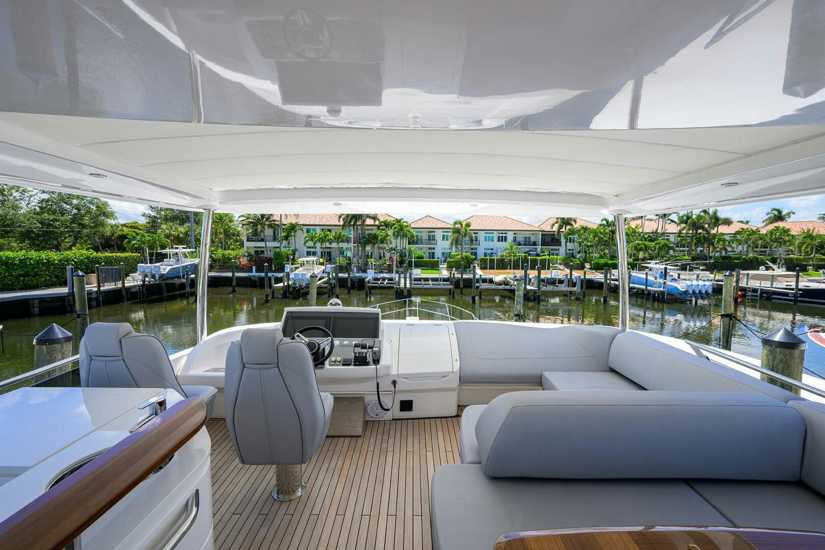 a room with a deck and chairs aboard TWIST OF FAITH Yacht for Sale