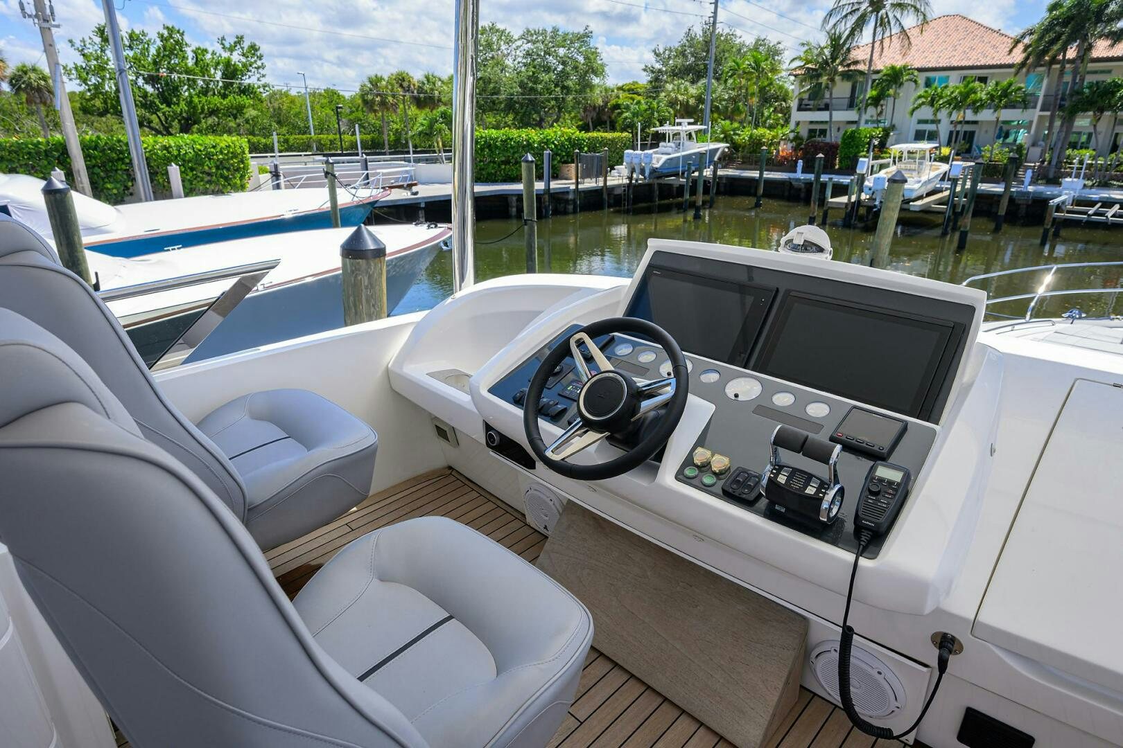 a boat with a radio and other boats in the background aboard TWIST OF FAITH Yacht for Sale