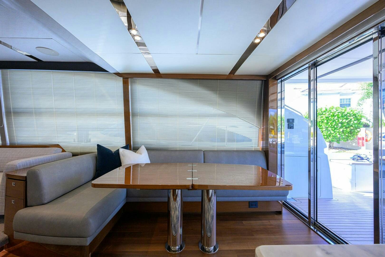 a room with a table and couch aboard TWIST OF FAITH Yacht for Sale