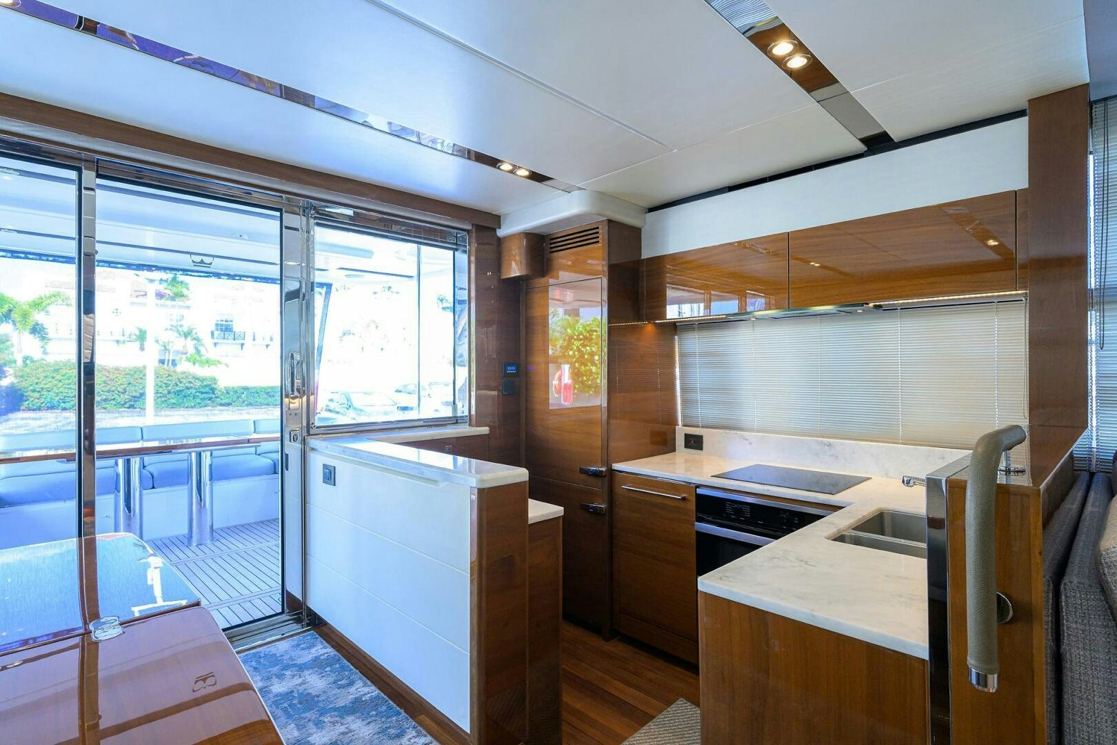 a kitchen with a glass door aboard TWIST OF FAITH Yacht for Sale