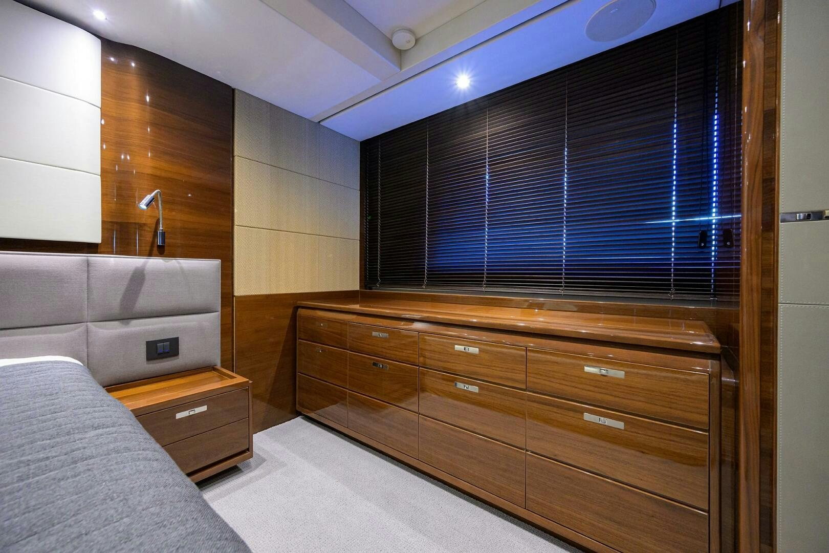 a room with a bed and a dresser aboard TWIST OF FAITH Yacht for Sale
