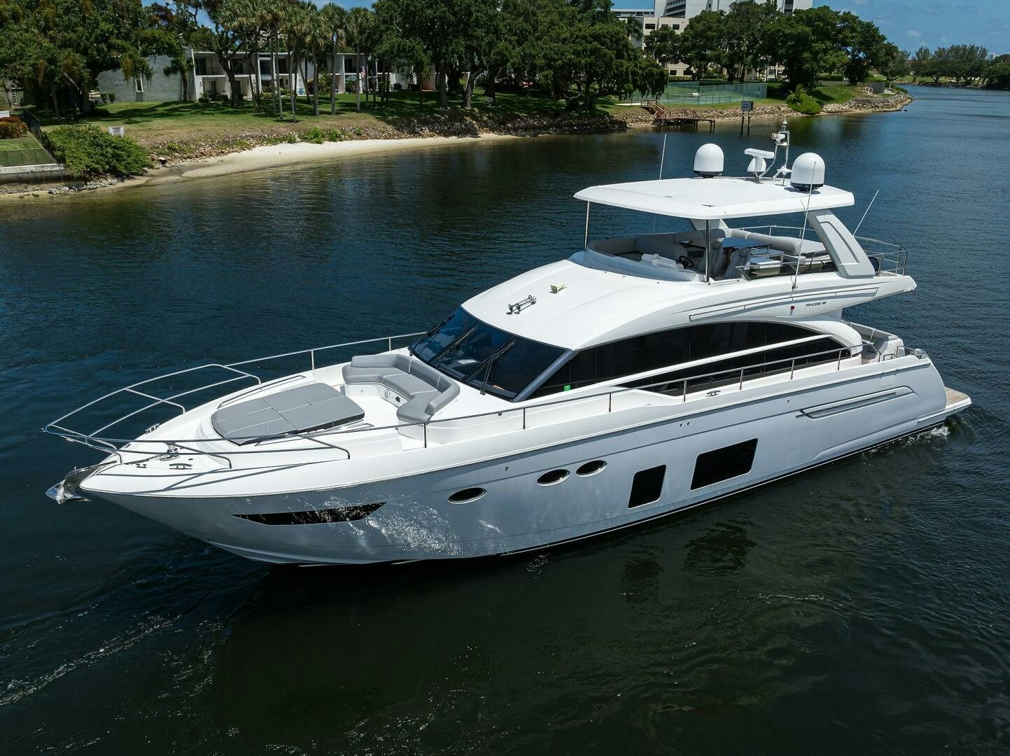 a white boat on the water aboard TWIST OF FAITH Yacht for Sale