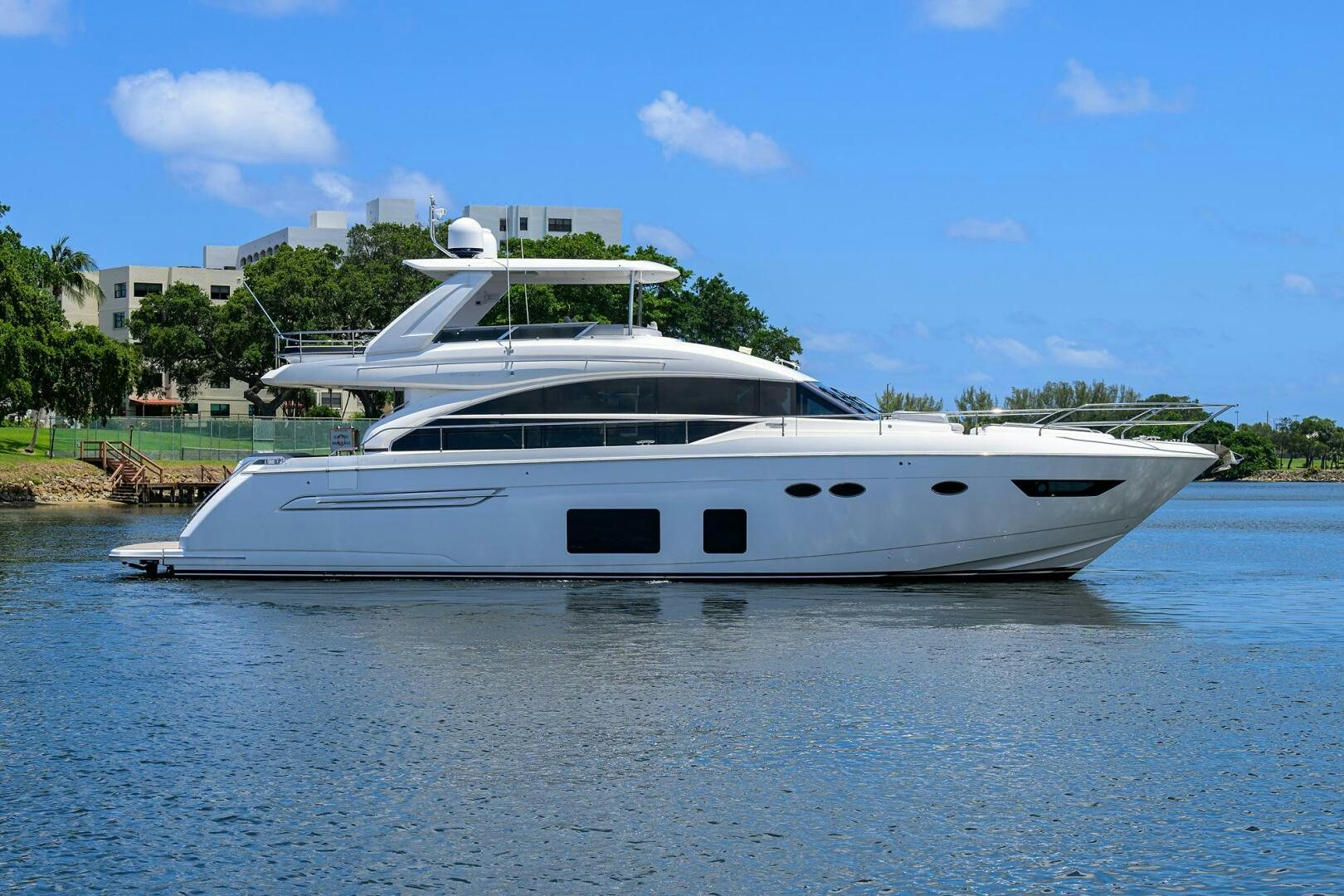 a white yacht on the water aboard TWIST OF FAITH Yacht for Sale