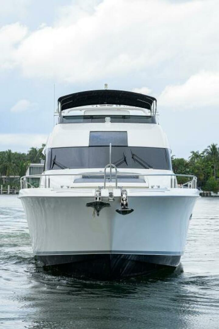 a white yacht in the water aboard LIVING THE DREAM Yacht for Sale