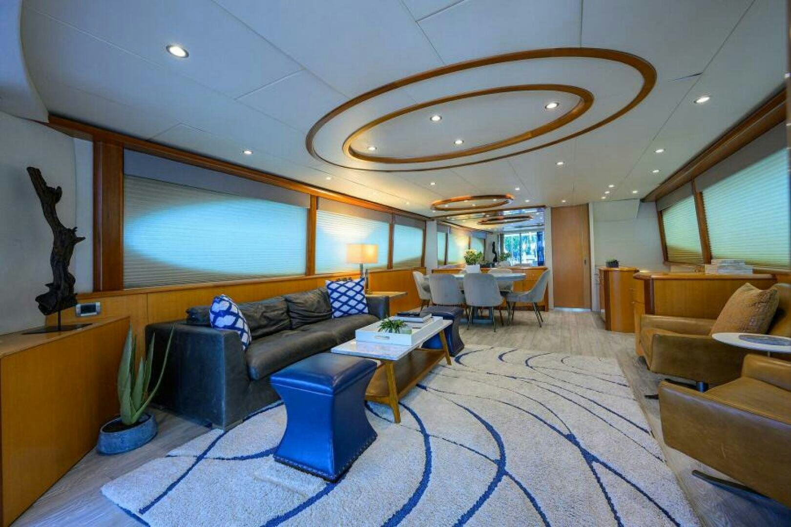 a living room with a large screen aboard LIVING THE DREAM Yacht for Sale