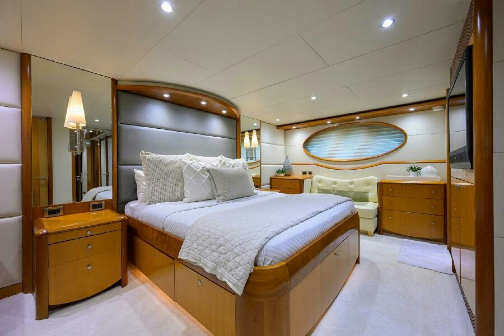 a bedroom with a large mirror aboard LIVING THE DREAM Yacht for Sale