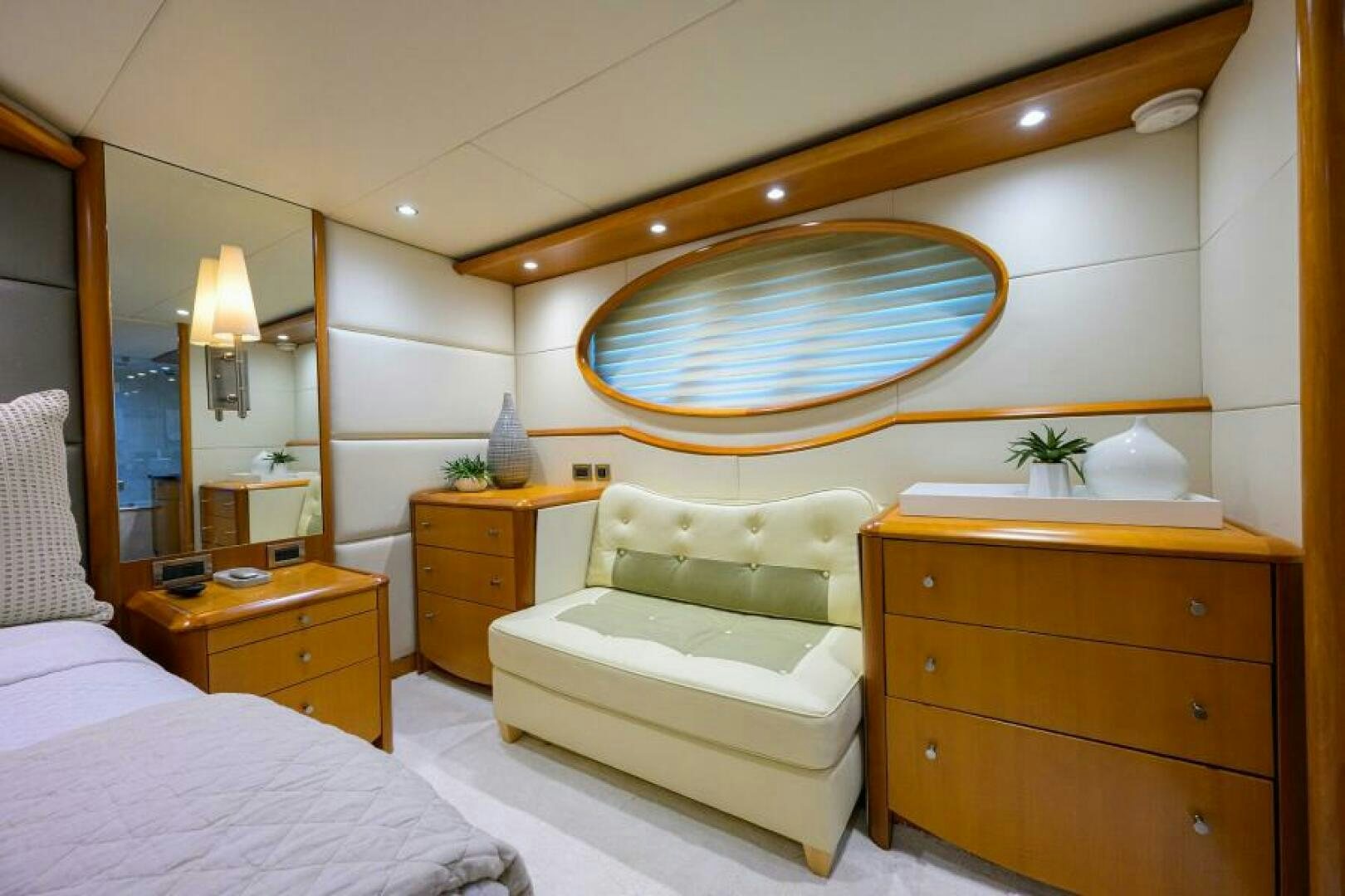 a bedroom with a large mirror aboard LIVING THE DREAM Yacht for Sale