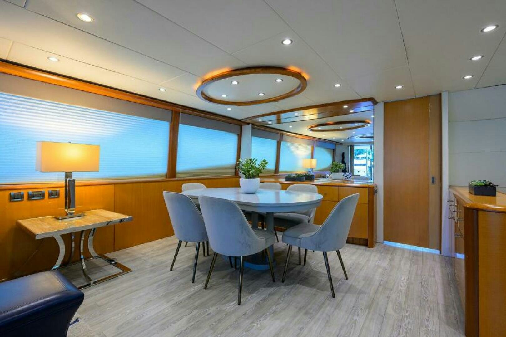 a room with tables and chairs aboard LIVING THE DREAM Yacht for Sale