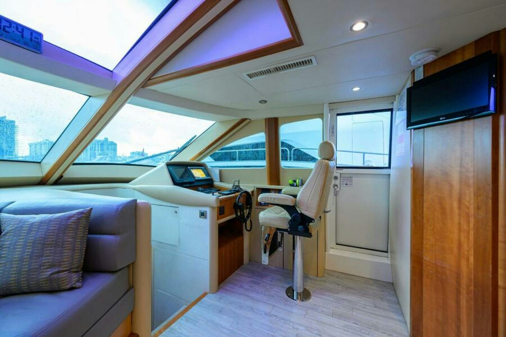 a room with a couch and a television aboard LIVING THE DREAM Yacht for Sale