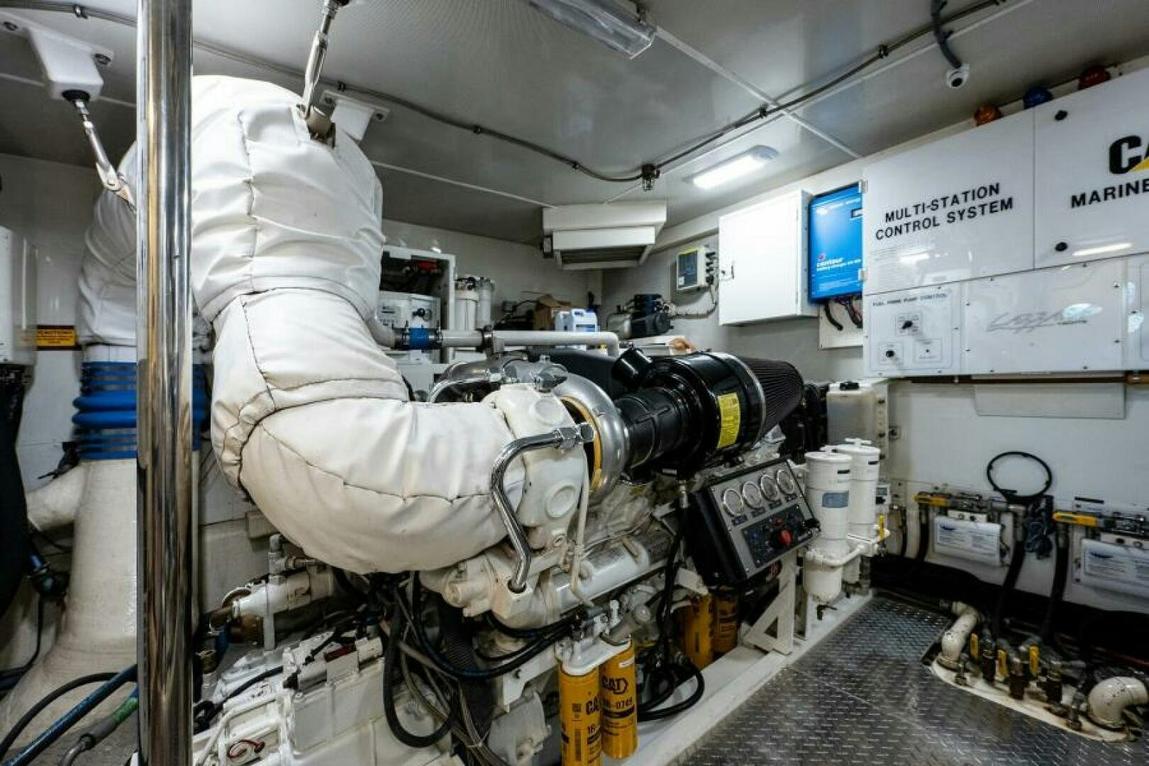 a large white machine with a large white object on the side aboard LIVING THE DREAM Yacht for Sale