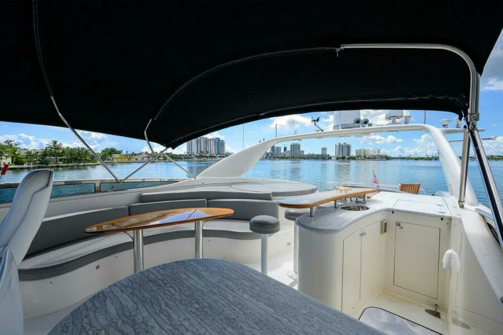 a boat with a surfboard on the deck aboard LIVING THE DREAM Yacht for Sale