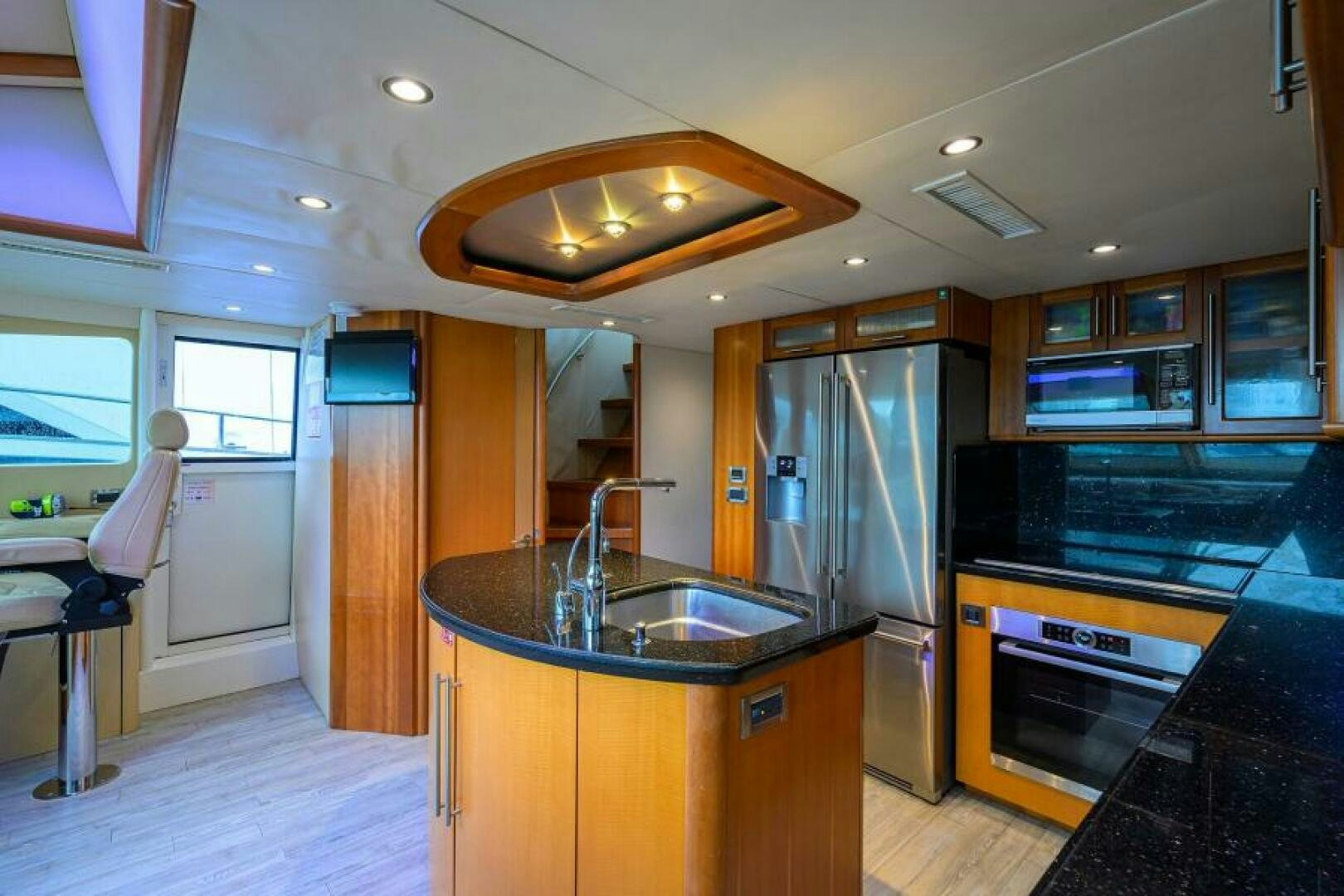 a kitchen with a stove and sink aboard LIVING THE DREAM Yacht for Sale