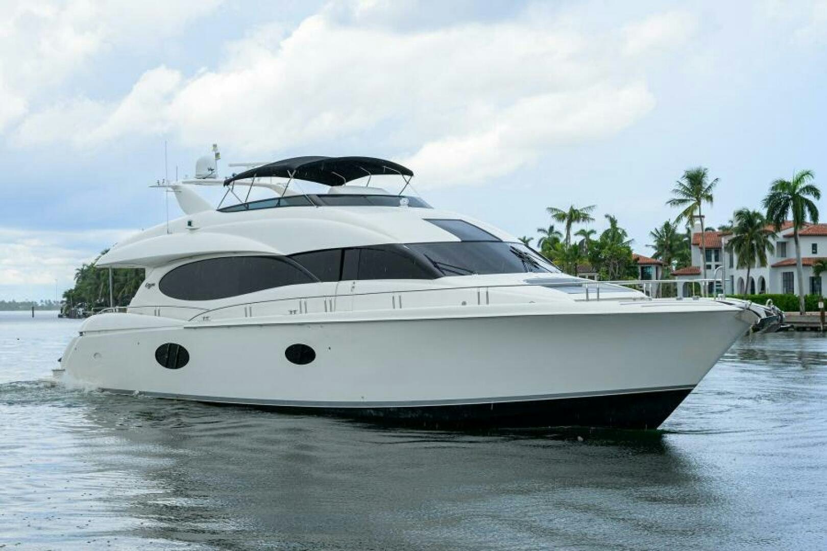 a white yacht on the water aboard LIVING THE DREAM Yacht for Sale