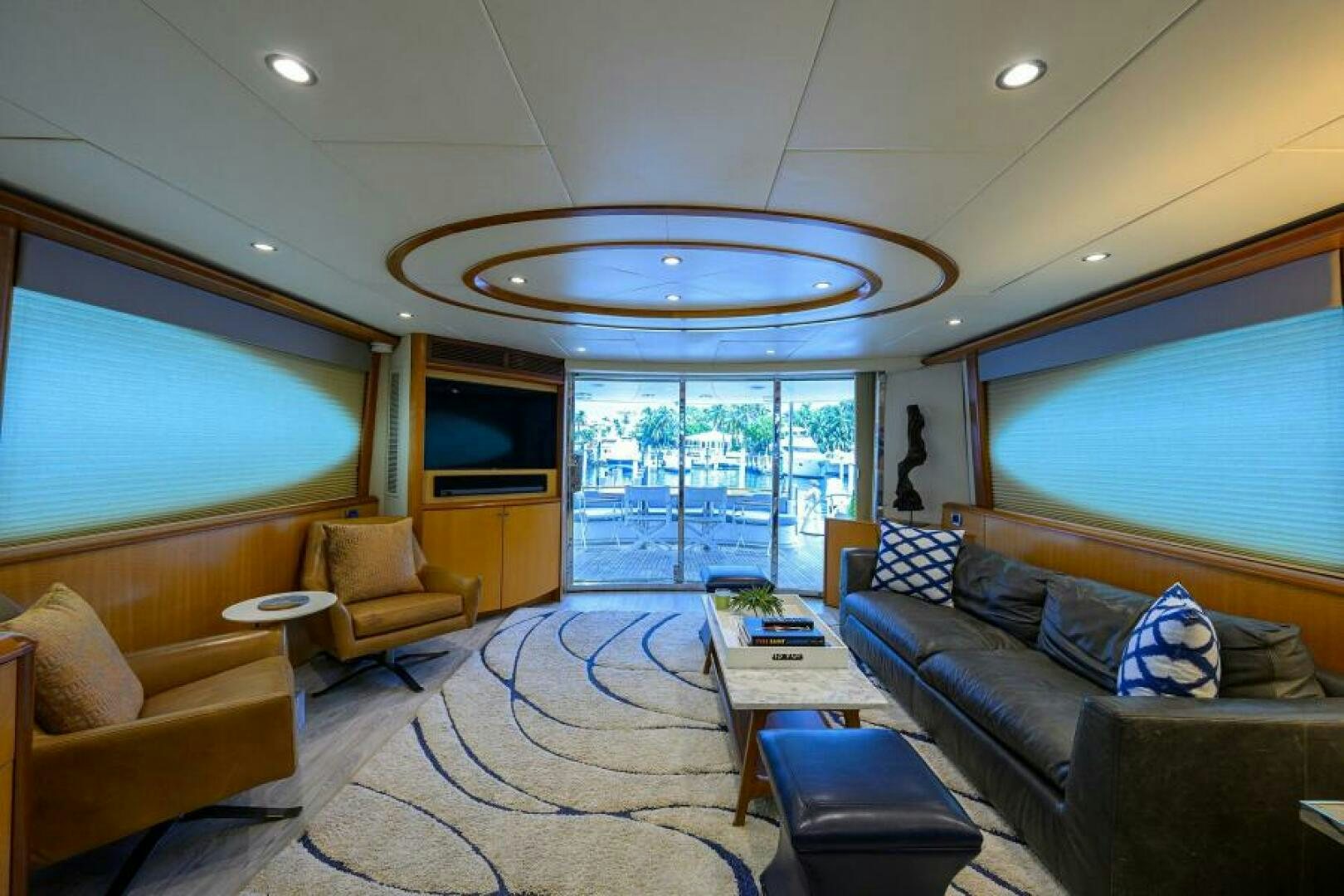 a living room with a large window aboard LIVING THE DREAM Yacht for Sale