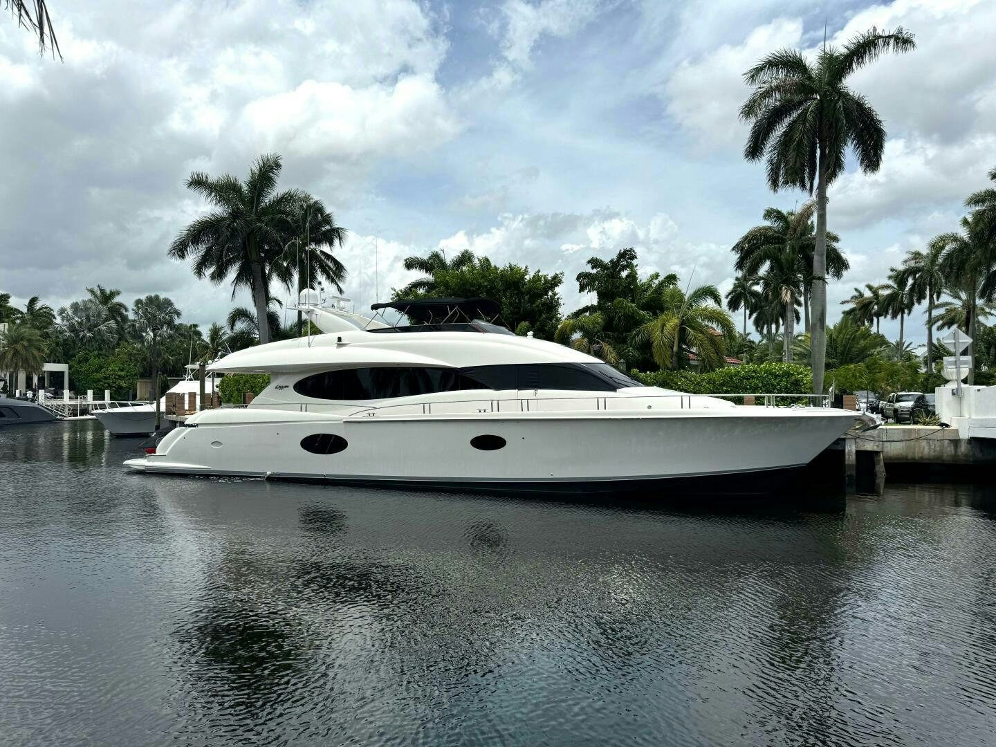 a white yacht in a body of water aboard LIVING THE DREAM Yacht for Sale