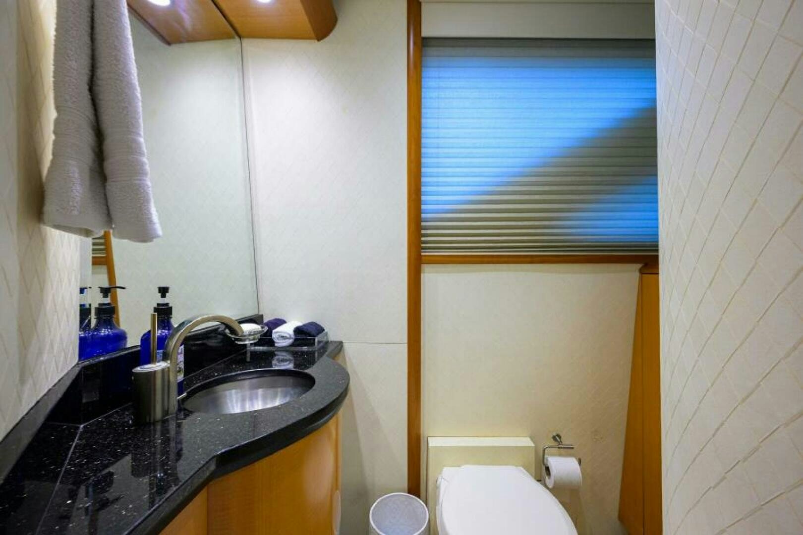 a bathroom with a sink and a mirror aboard LIVING THE DREAM Yacht for Sale