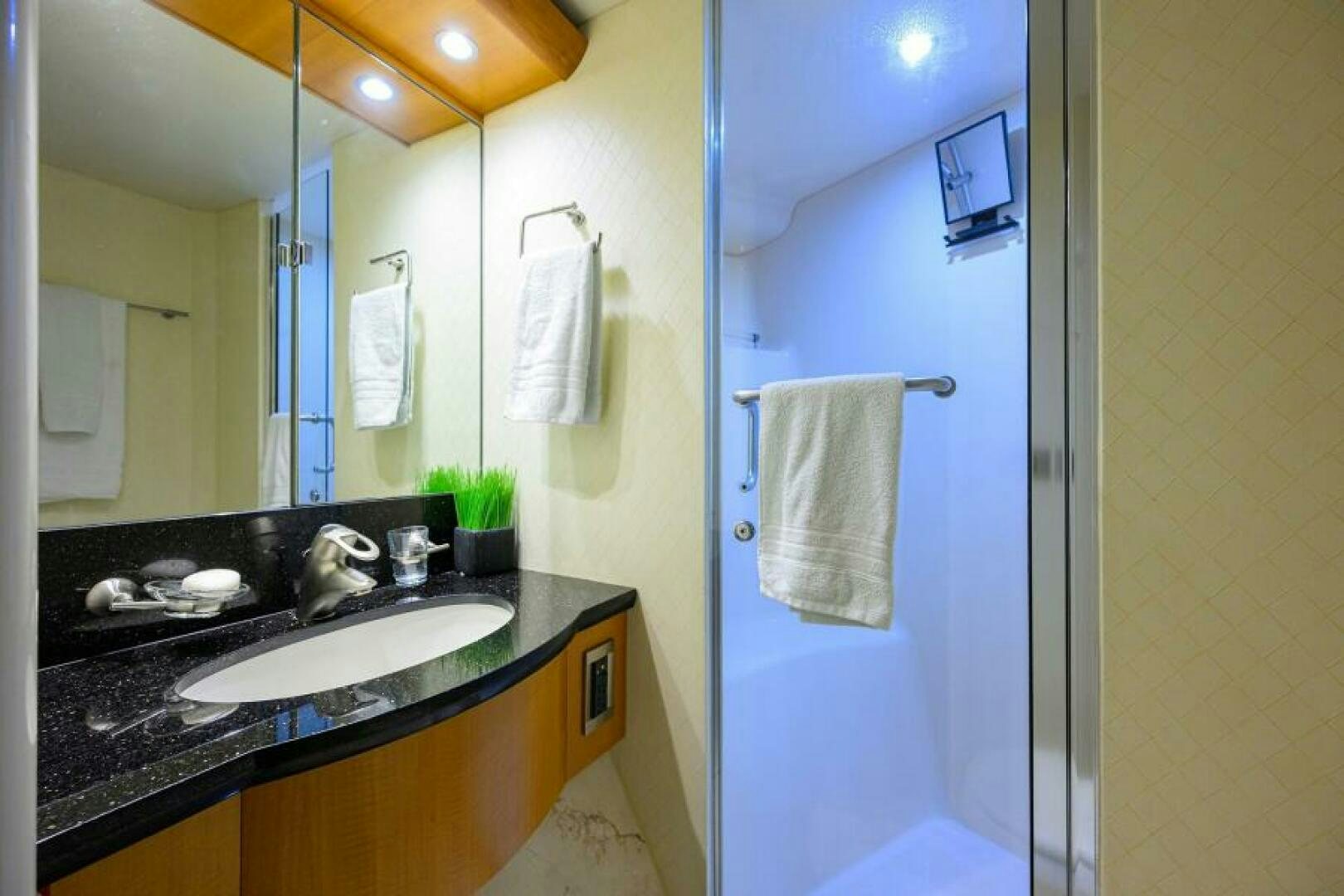 a bathroom with a large mirror aboard LIVING THE DREAM Yacht for Sale