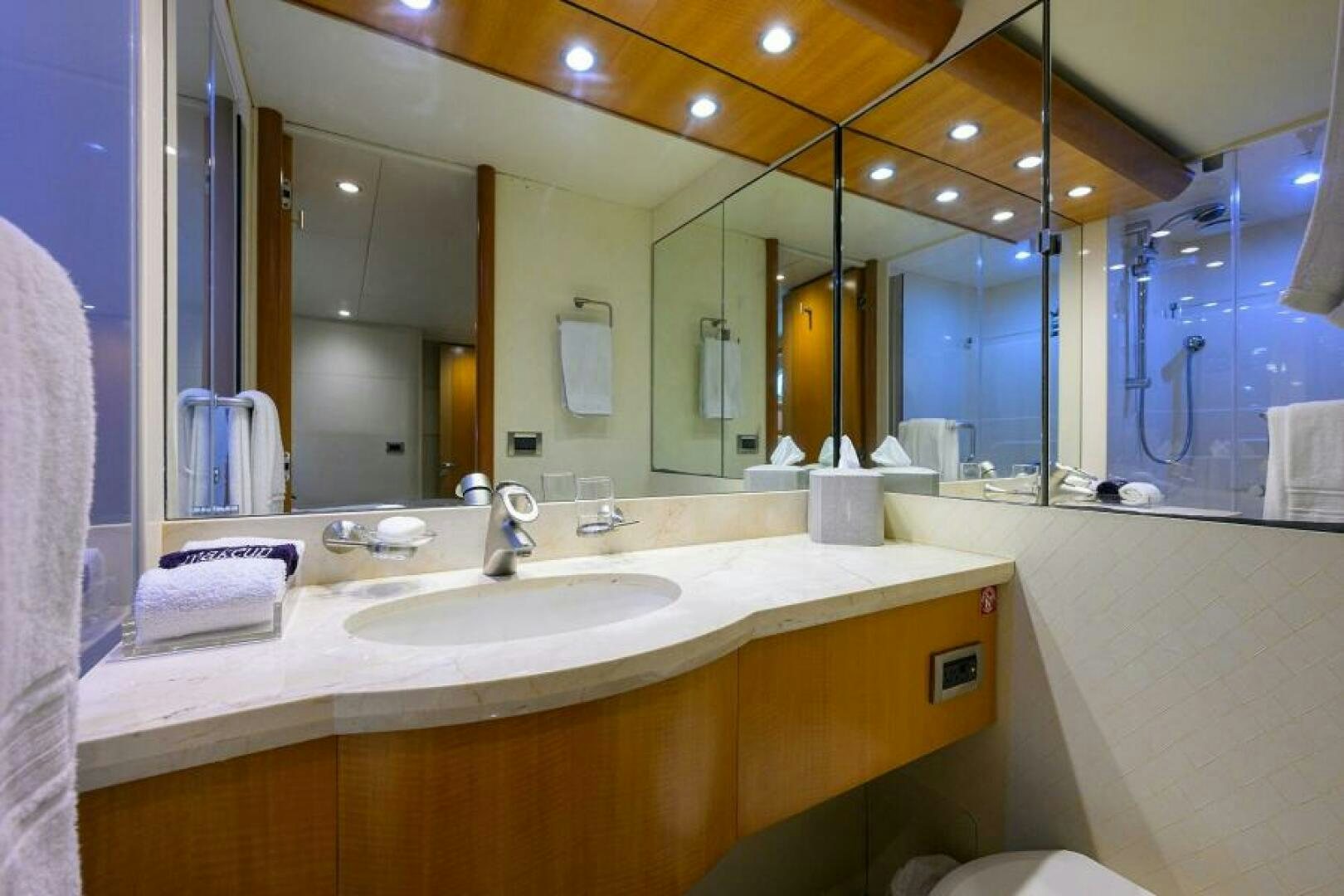 a bathroom with a large mirror aboard LIVING THE DREAM Yacht for Sale
