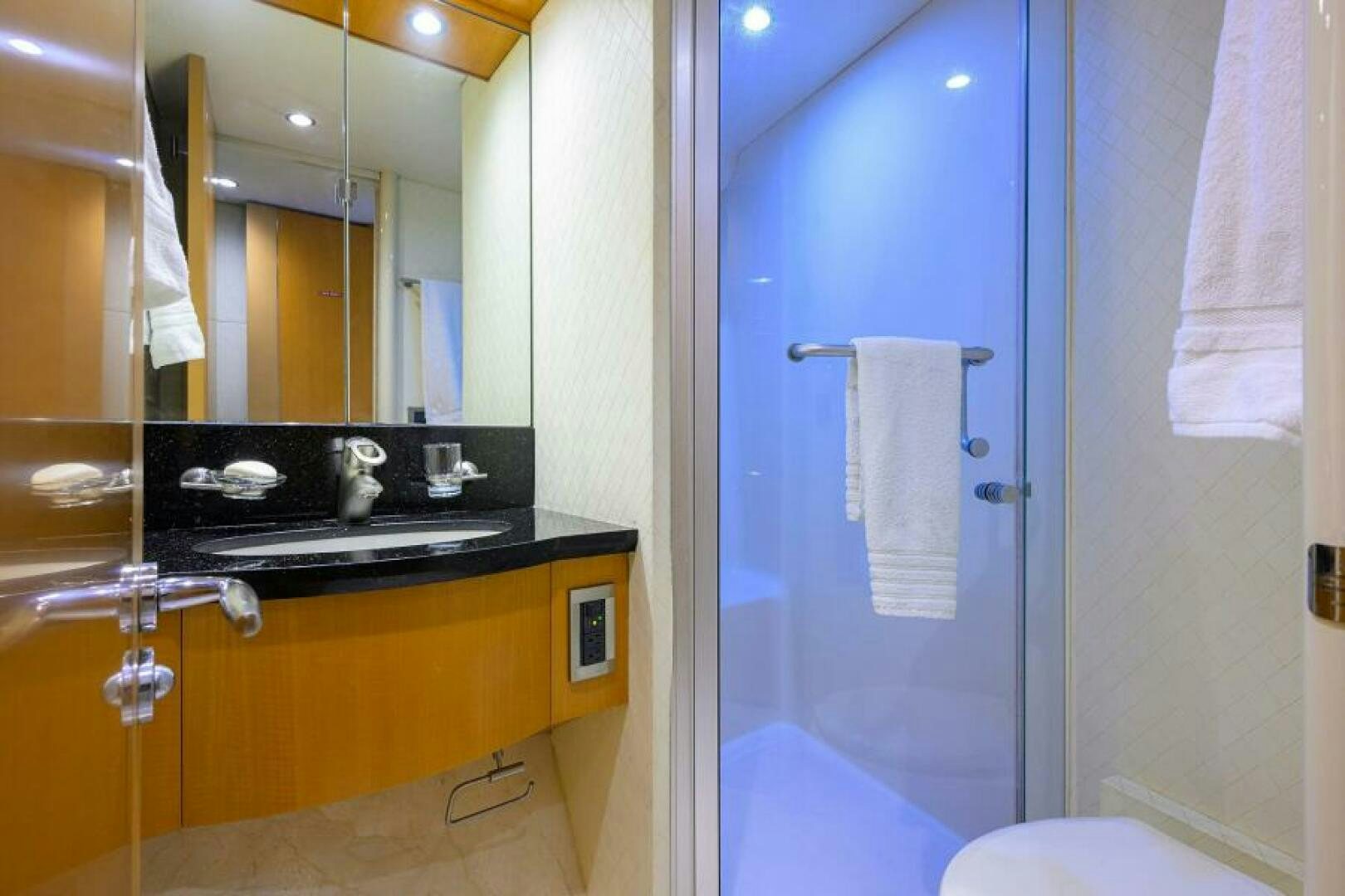 a bathroom with a sink and a mirror aboard LIVING THE DREAM Yacht for Sale