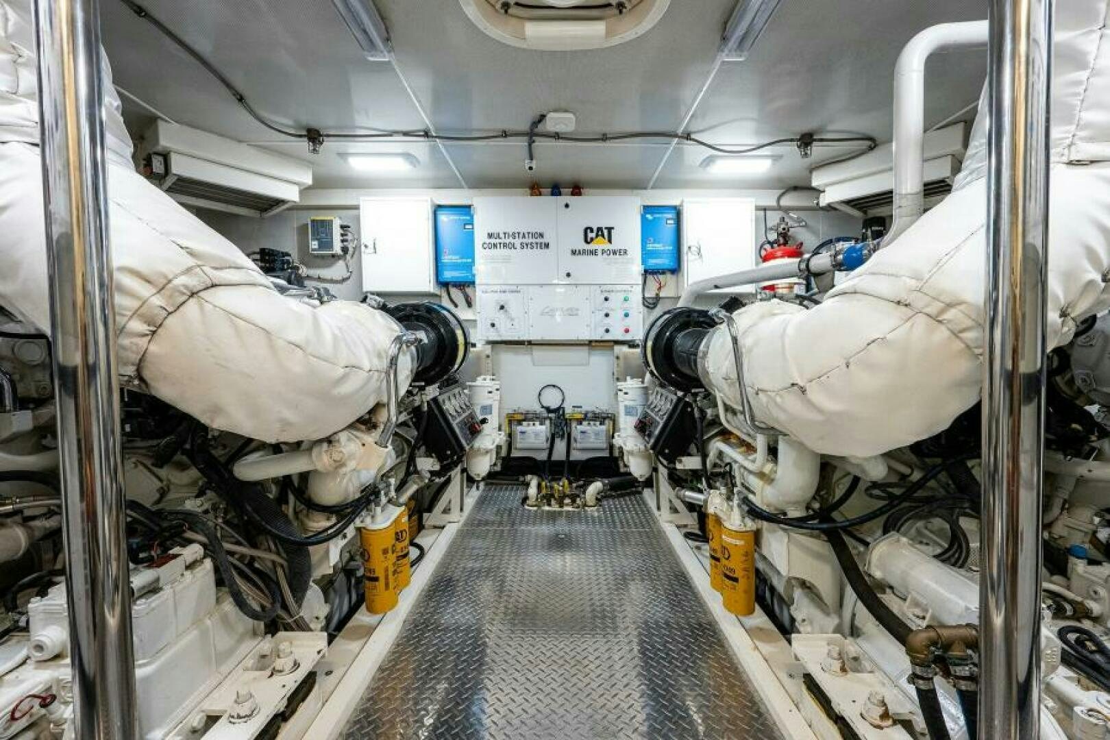 a large white machine with pipes aboard LIVING THE DREAM Yacht for Sale